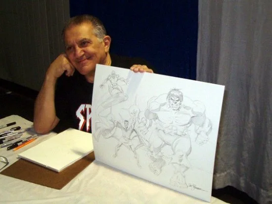 Sal Buscema poses with a Defenders piece done for charity.