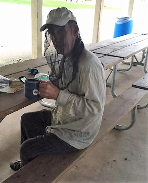 Dave in mosquito netting, standard garb for this trip.