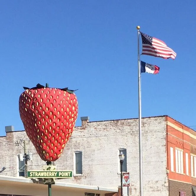 Strawberry Point, Iowa, with the biggest strawberry in the world and the best pie. Again, note the horizontal flag.