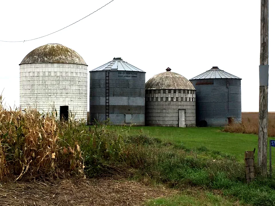 Four silos, all so different, sizes, shapes and patterns. Being an artist, I always wonder about who created the designs for these very functional buildings. They all hold harvested crops, and yet they each have their own look.