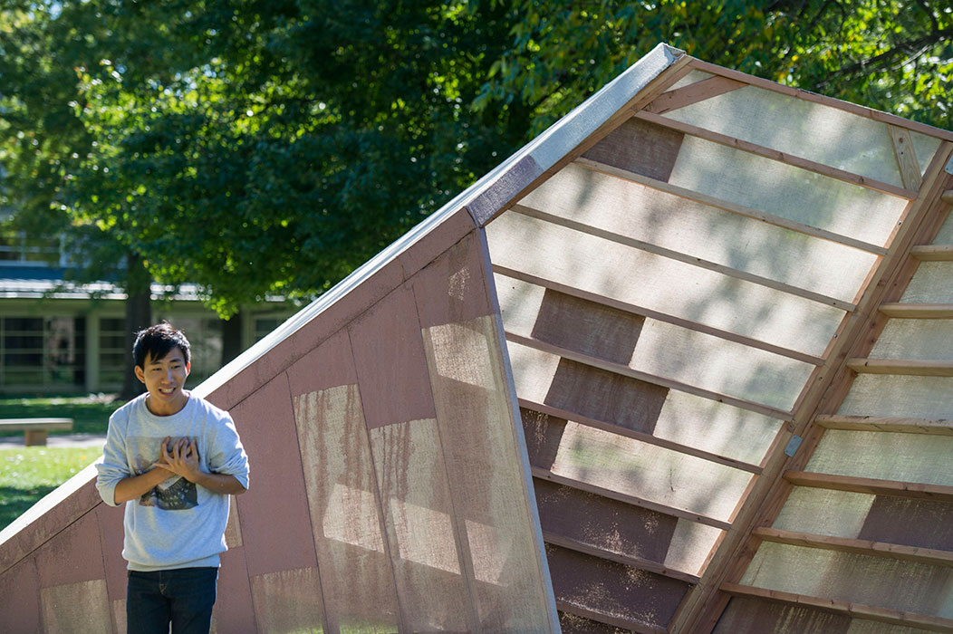   Sam Lai gives a poetry reading with  Surface to Sukkah  serving as the stage. Photo by Joe Angeles/WUSTL Photos.  