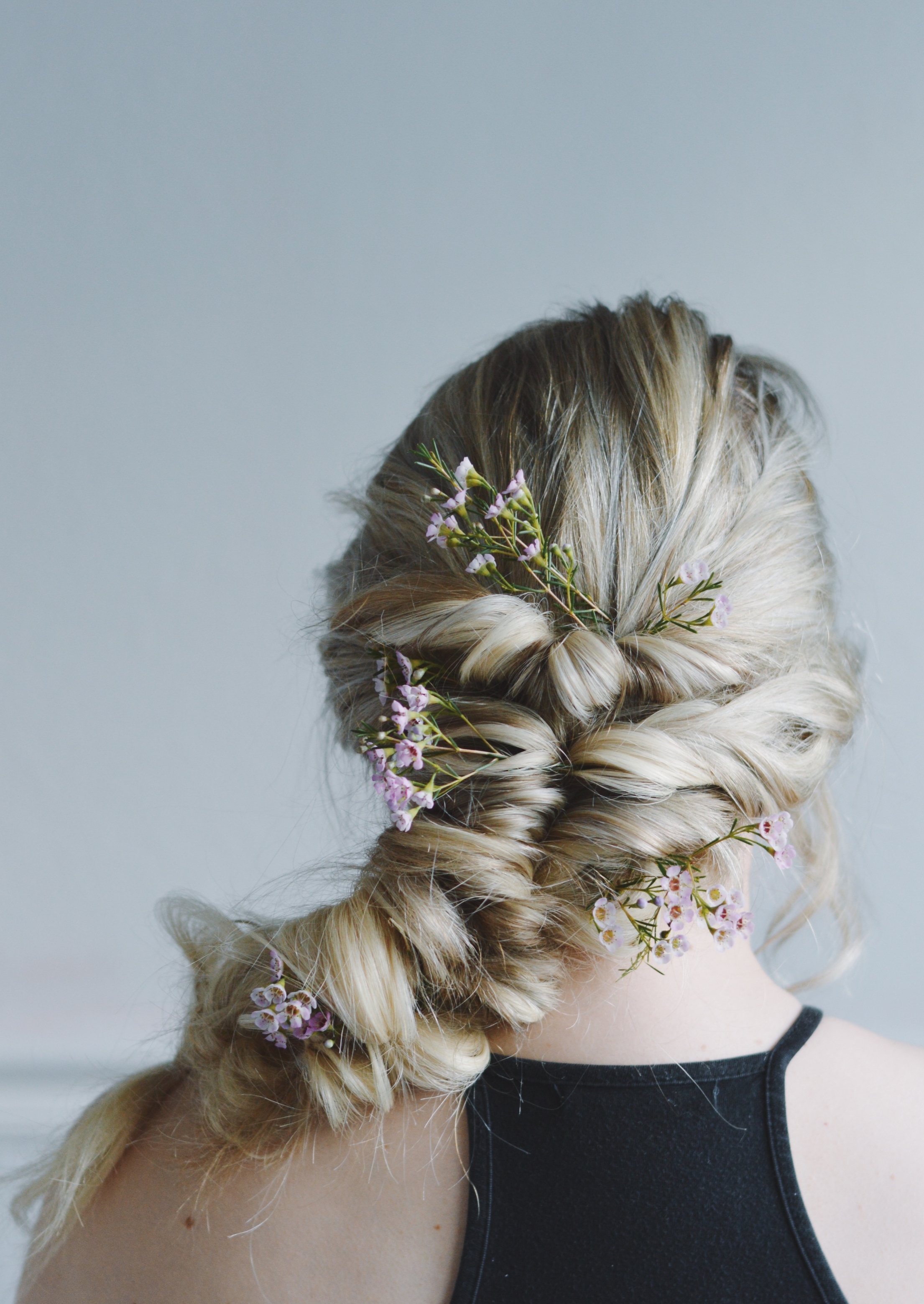 Hey girls! I hope you're having a fabulous week. I'm absolutely obsessed with this twist braid. This style somewhat resembles a fishtail, but it's a bit more intricate. If you decide to go with this braid, feel free to skip your arm workout because this is killer! It takes a little while to perfect, & pull apart so if you're in a rush, I'd recommend doing a simple fishtail. This requires a lot of clear elastics, but it's so worth it once you're finished! 1. Brush out all the tangles 2. Take a small section of hair from the top, and secure it with an elastic 3. Take the hair (above the elastic) and slightly split it into two sections 4. Flip the loose part of the pony tail up through the space you created with two section (i know its confusing) 5. It should look tight and twisted. Repeat this step with the rest of your hair 6. Once you're at the end, use your thumb, pointer, and middle finger to pull apart the braid. 7. You might have to tug a little bit (depending on how tight you secured the elastics) - but it'll look so cute and finished once you pull it apart! I added some flowers to it because it adds a cute boho touch 8. Take a photo and post to instagram! :) Hope you have an awesome day tomorrow, it's WEDNESDAYYYY!!! Which means we're almost to Friday! Please feel free to request a video tutorial in the comments which I'll be sure to film :)