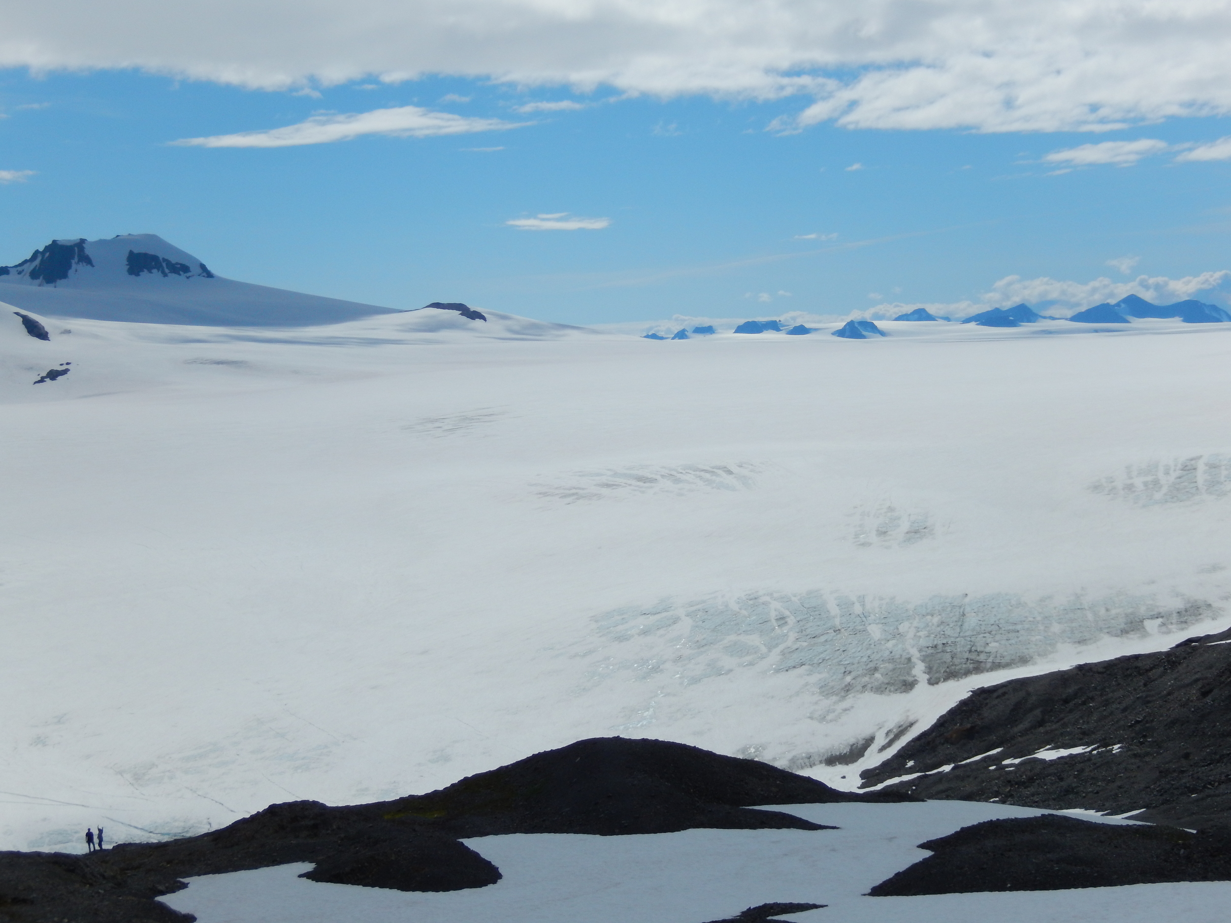 at the top you can see how the mountains are entombed in ice as just the peaks poke out above the ice in the distance