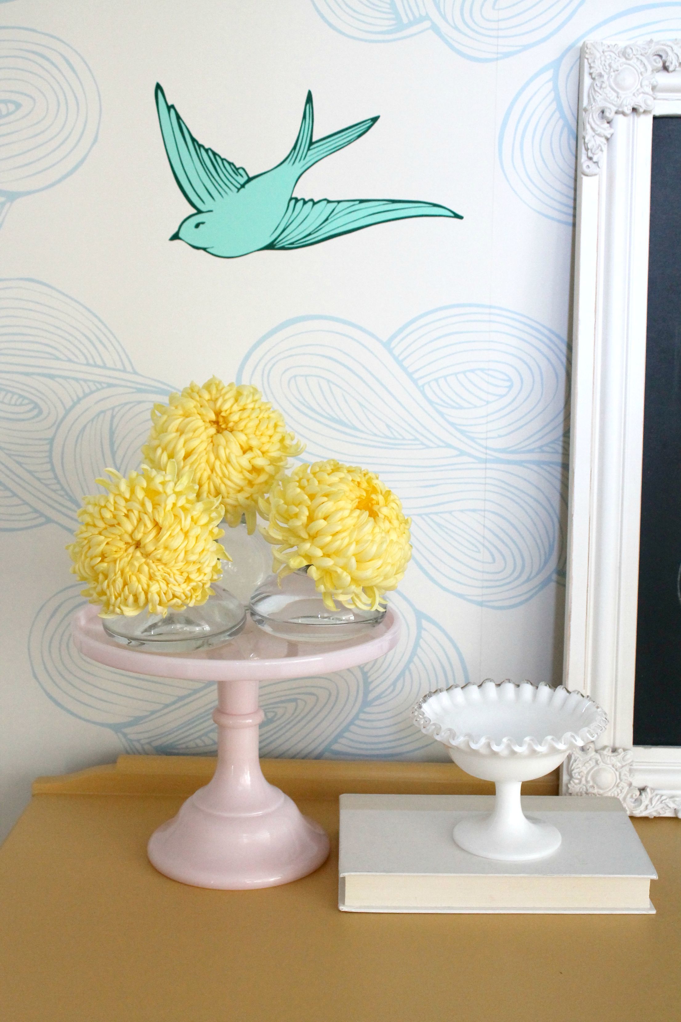 Cheery nook with wallpaper, bud vases, cake plate and ruffled bowl