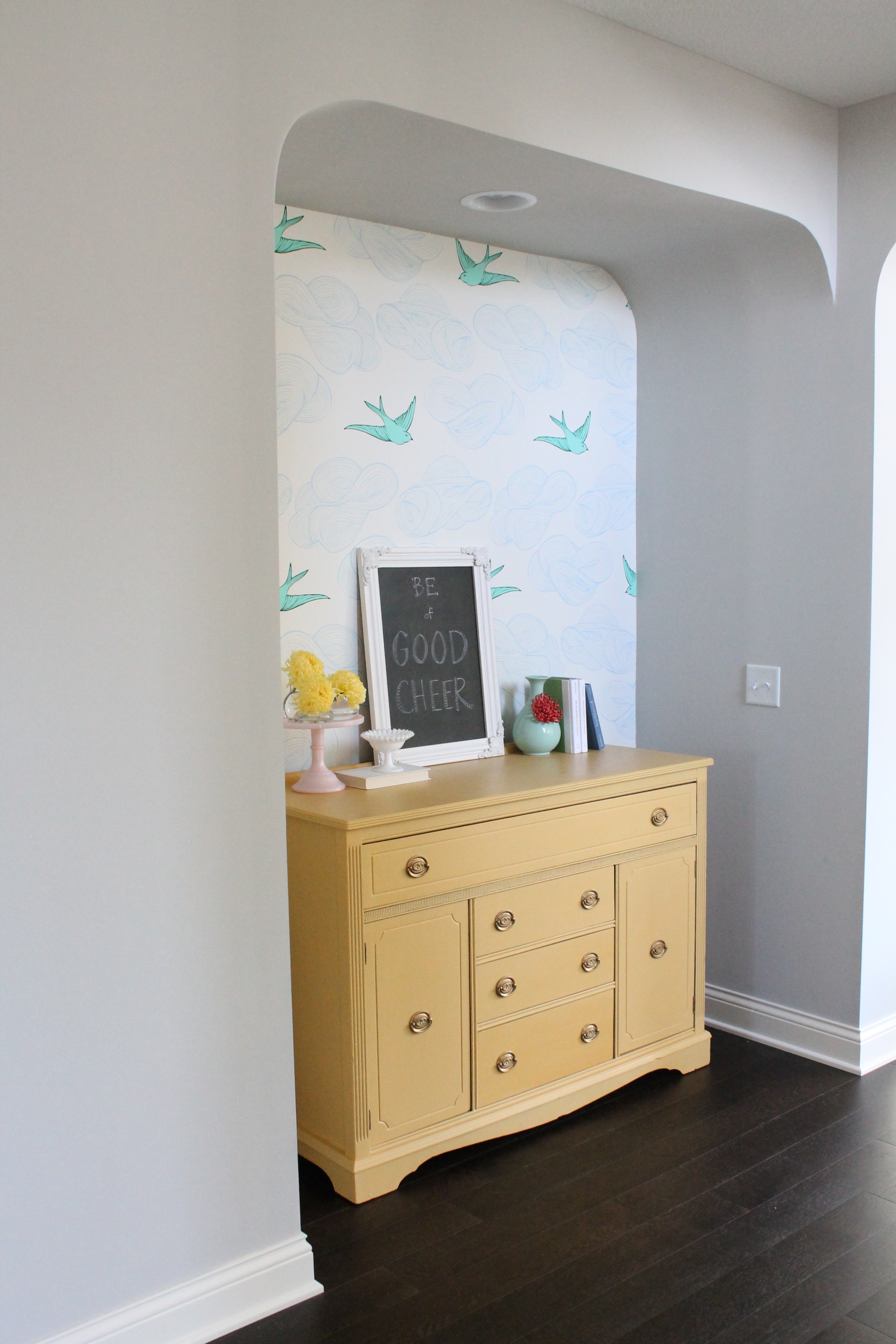 Cheerful Wallpapered Nook With Yellow Sideboard