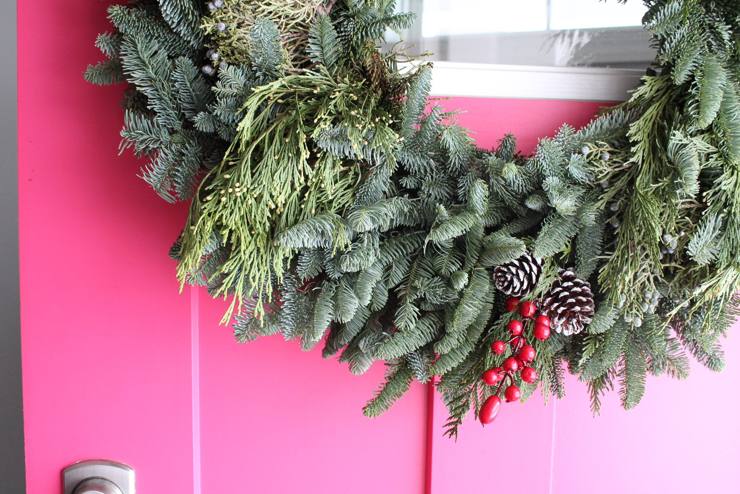 Pink Front Door with Evergreen Wreath