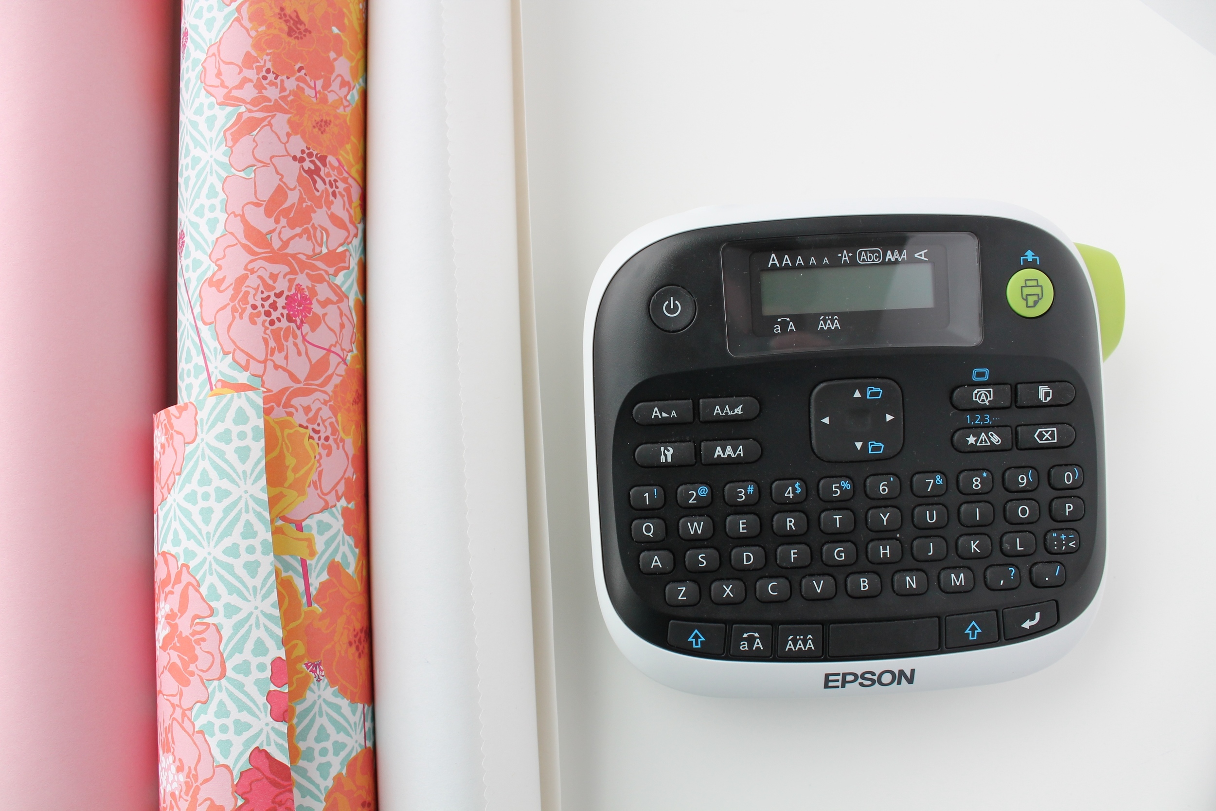 Epson Label Maker and rolls of paper from Paper Source. These tools are perfect for recovering books when styling a bookcase.