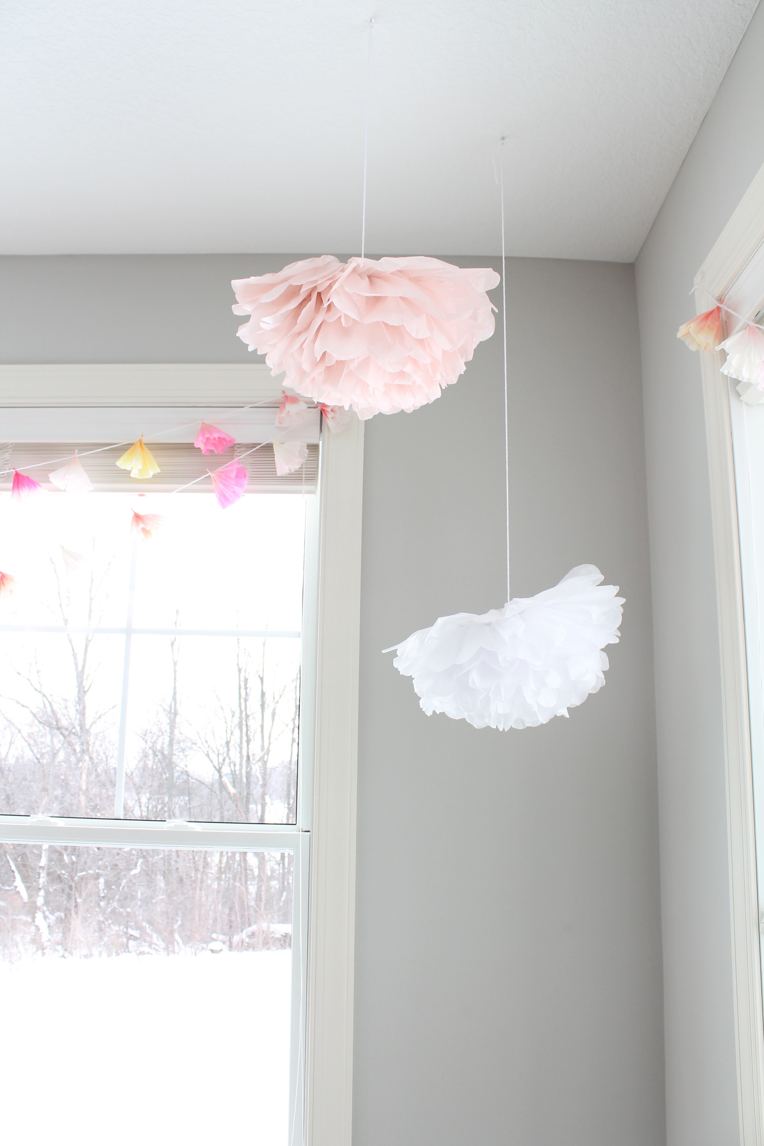 Giant tissue paper flowers are the perfect decoration fo a little girl's garden tea party.