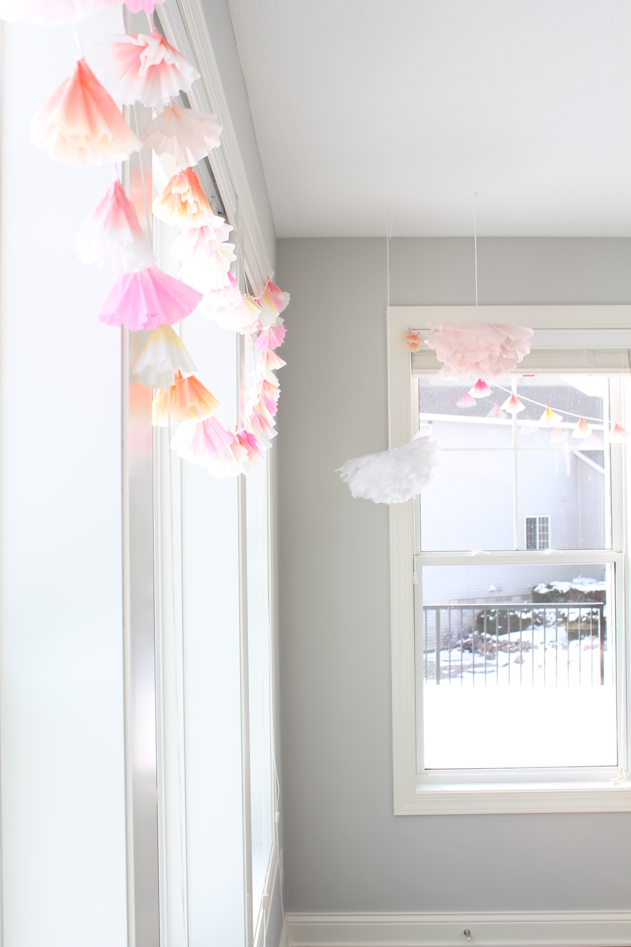 Coffee Filter garland and giant tissue paper flowers for the perfect garden tea party.