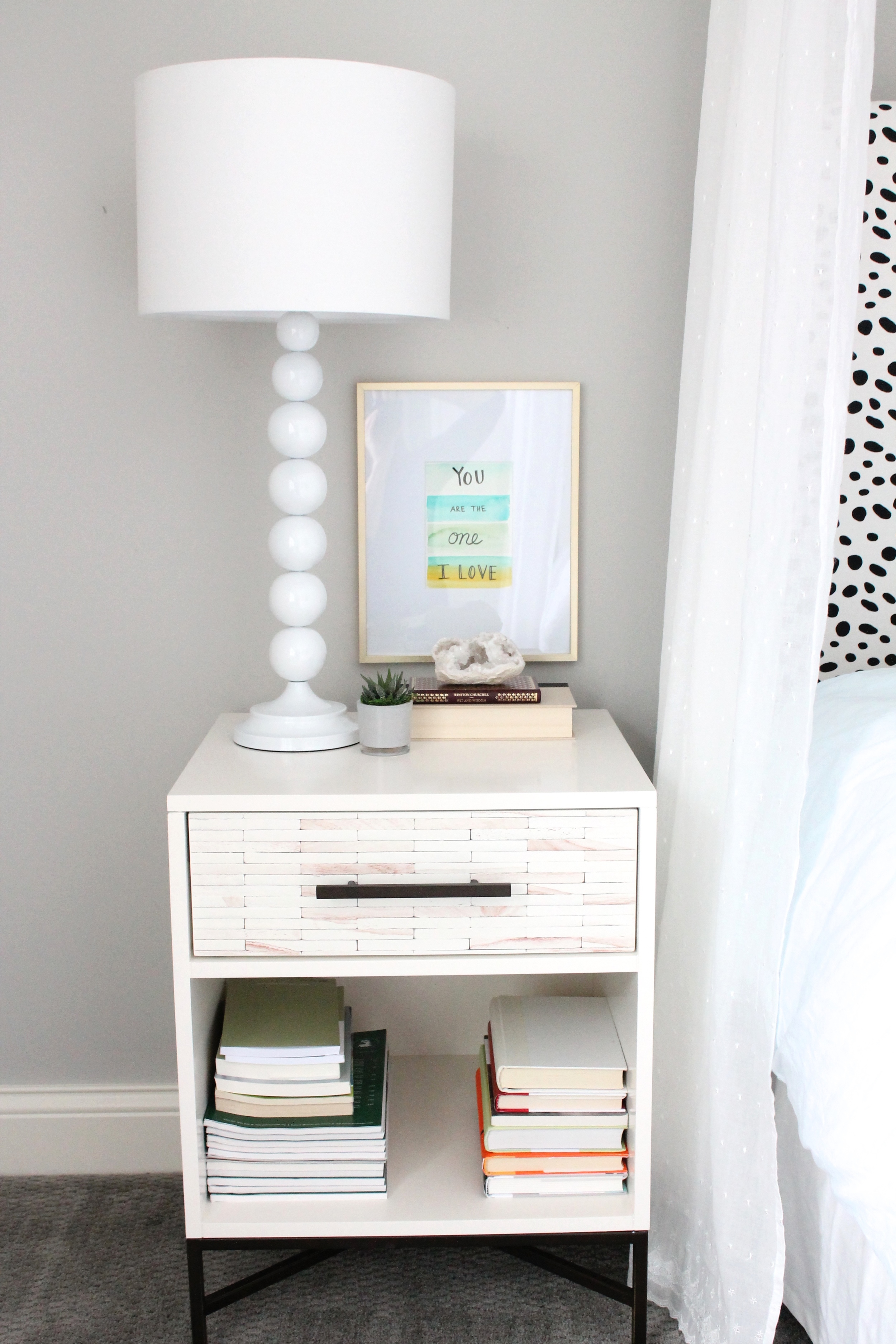 West Elm Nightstand with watercolor artwork in a gold frame. Lovely master bedroom.