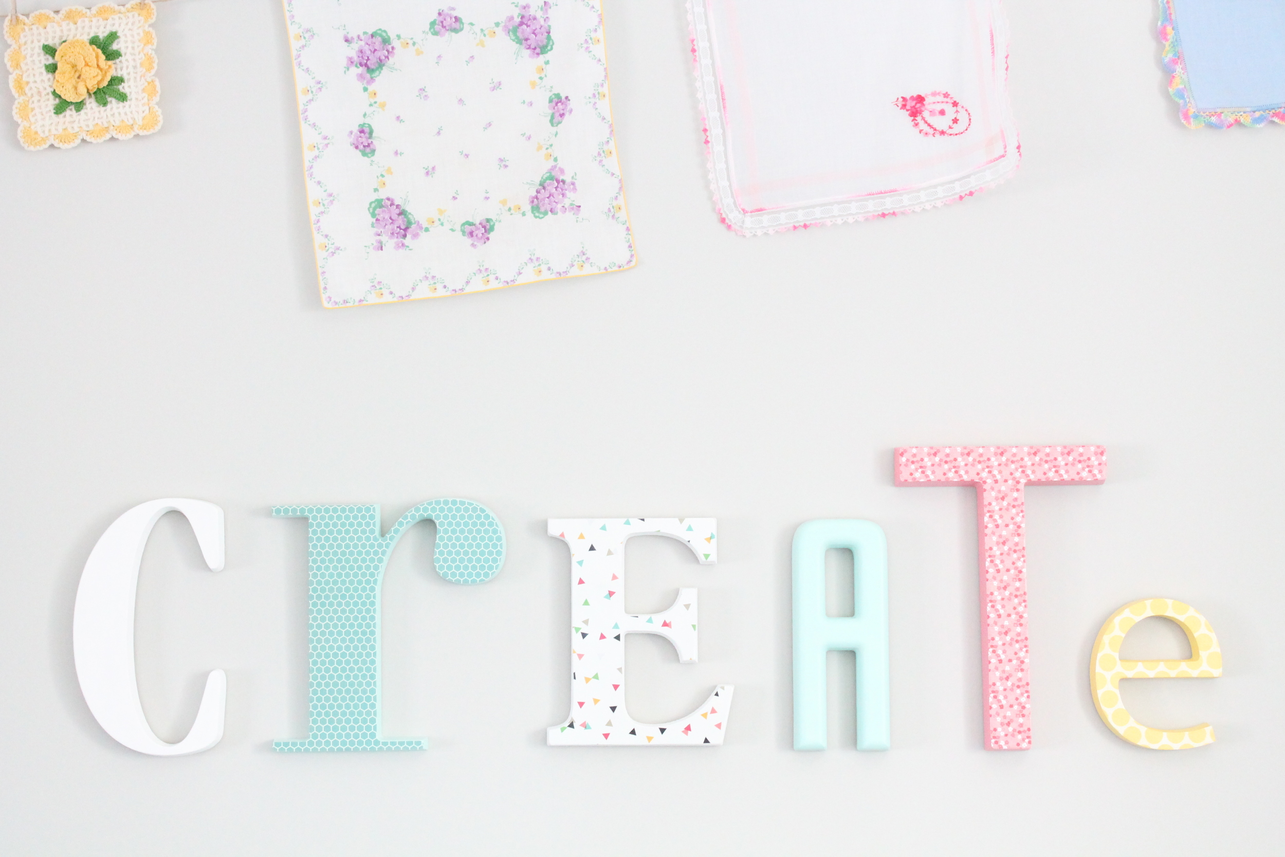 DIY letters for the family craft room. Painted each letter a different color and covered some with scrapbook paper.