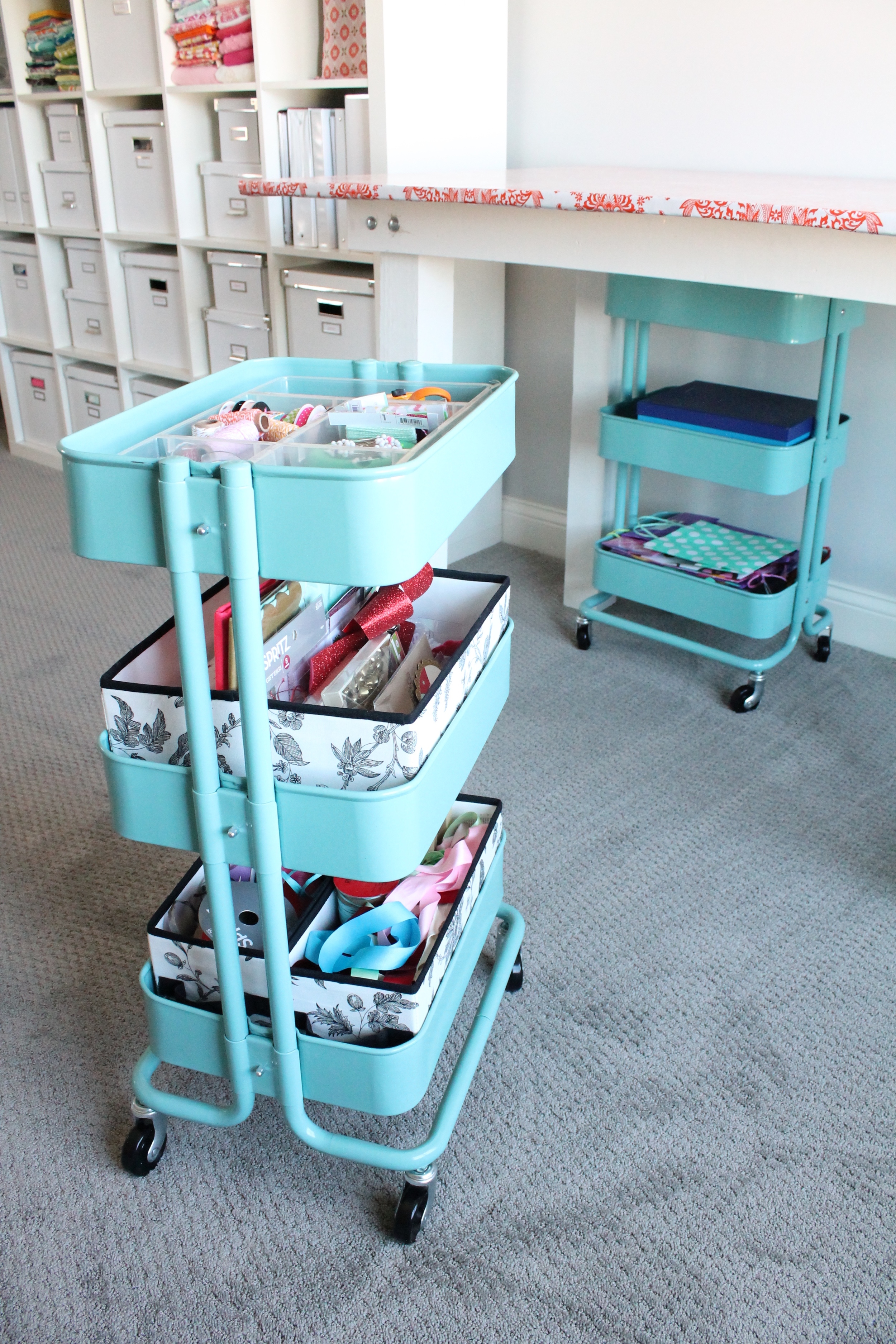 Aqua rolling carts from Ikea. Perfect place to organize supplies for the craft room.