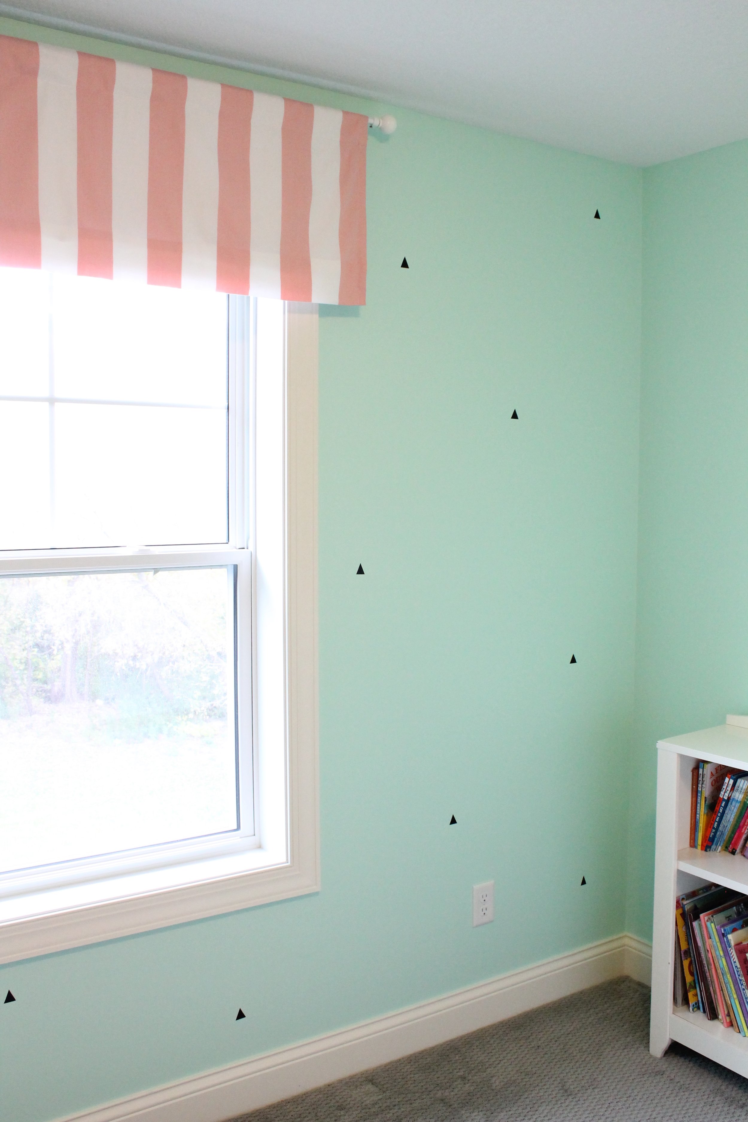 Ice cream inspired bedroom with mint chocolate chip walls.