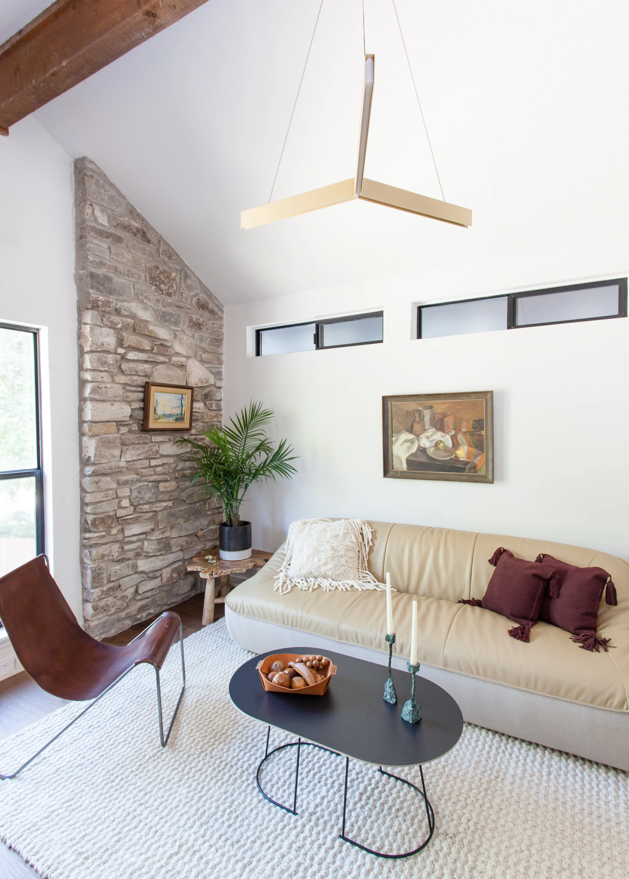 ERIN WILLIAMSON | OKENA RESIDENT BRASS TRIANGLE PENDANT URBAN OUTFITTERS SOFA