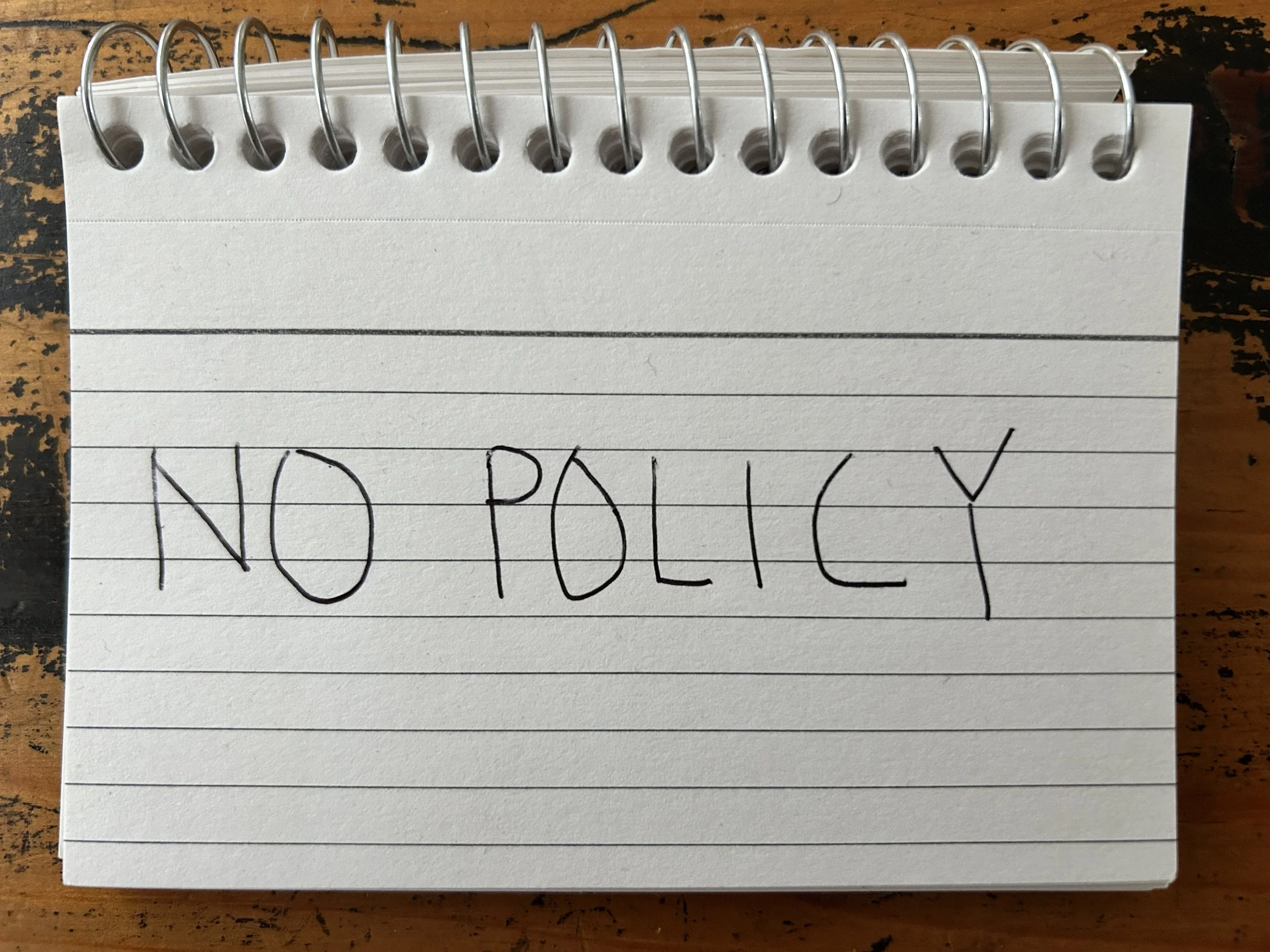 An index card on which is written, "no policy."
