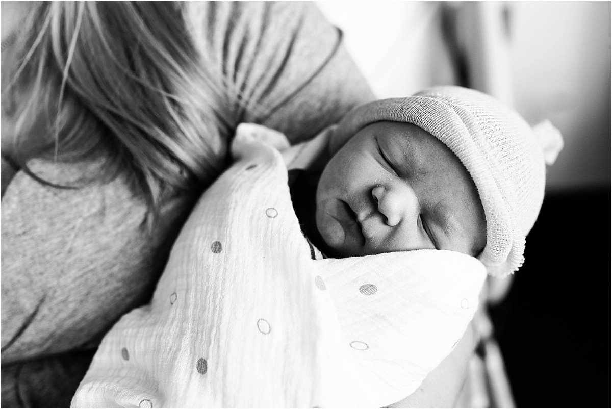 newborn baby boy in his mom's arms in Orlando, Florida, hospital room