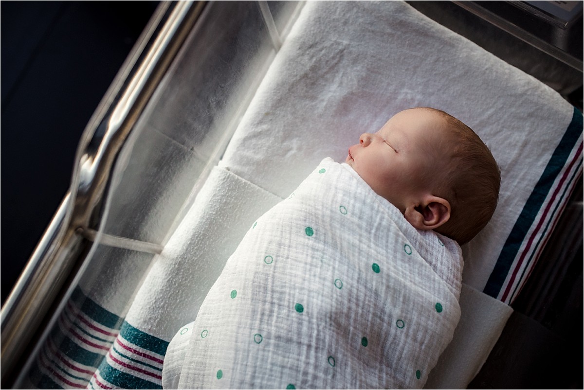 Newborn baby boy in hospital bed | Orlando Lifestyle Newborn Photographer
