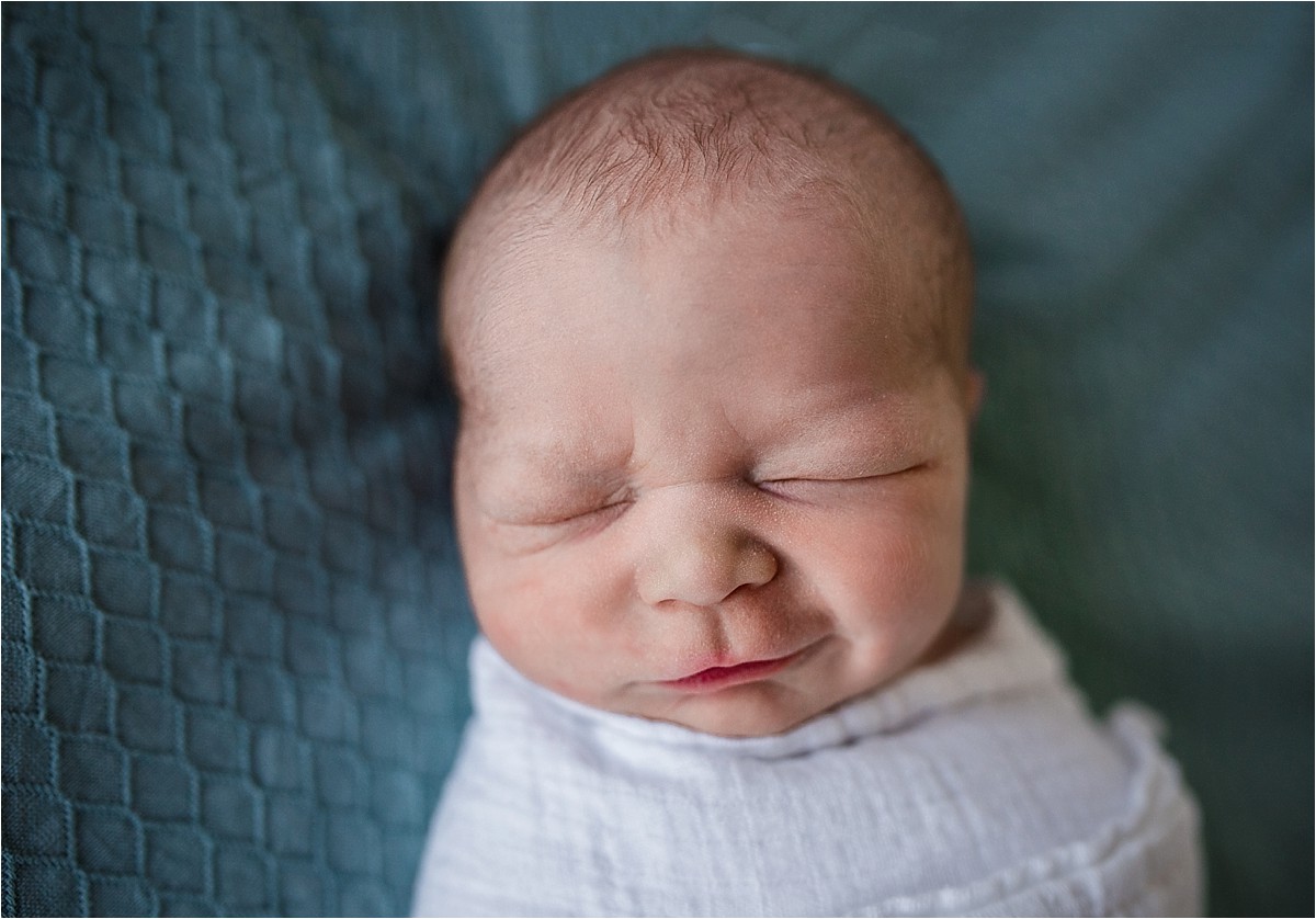 Newborn baby boy smiling for his first photoshoot | Central Florida Newborn Photographer