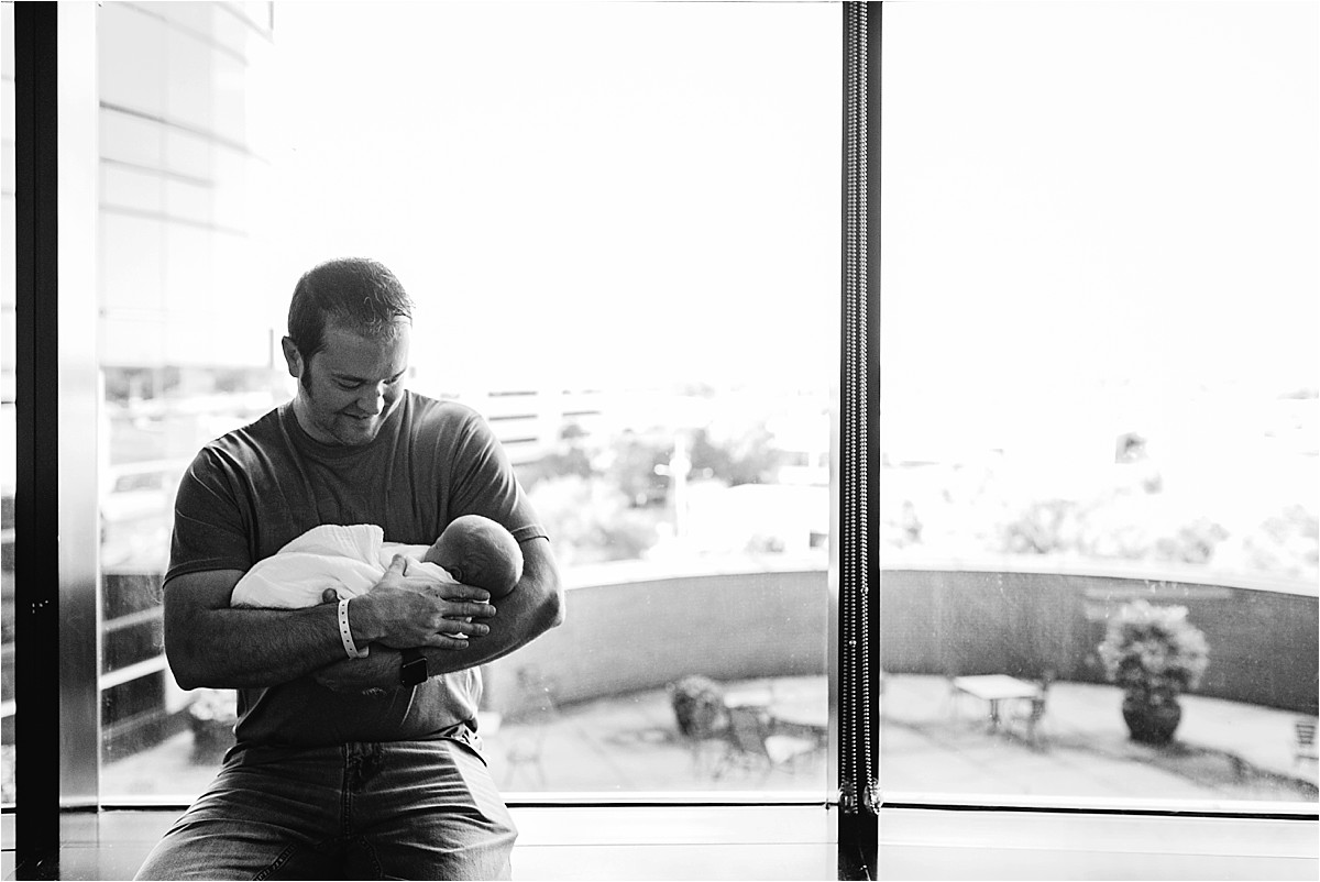 Dad holding baby boy for the first time in hospital | Orlando Fresh 48 Photographer
