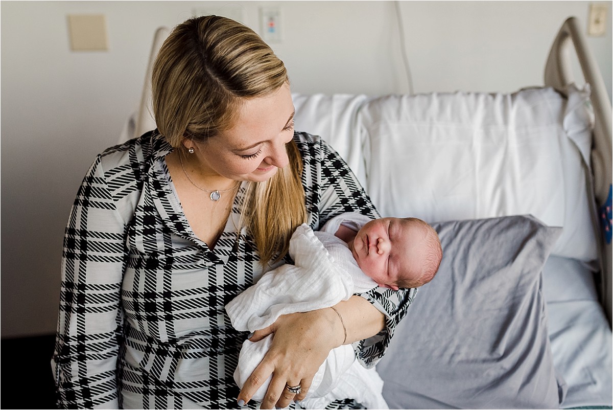 Mom admiring her brand new baby boy | Orlando Newborn Fresh 48 Photographer