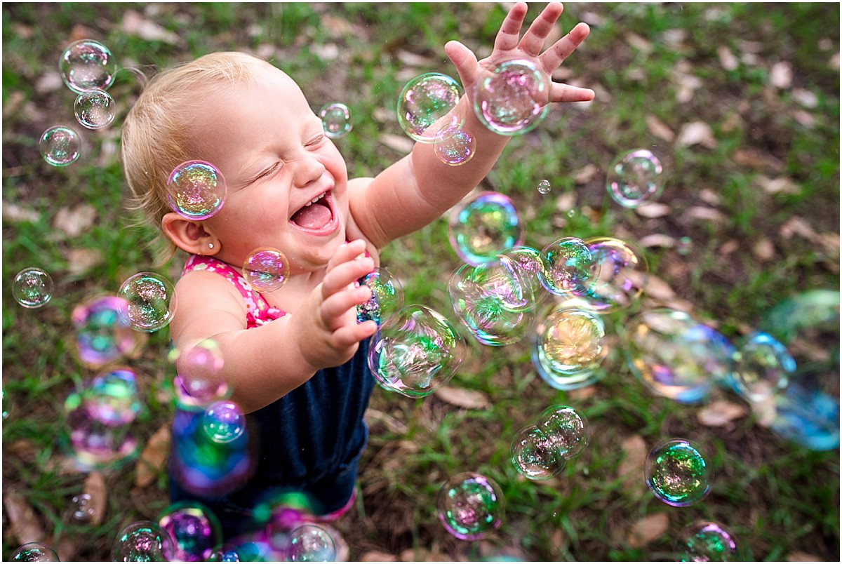 little girl in Winter Park chasing bubbles