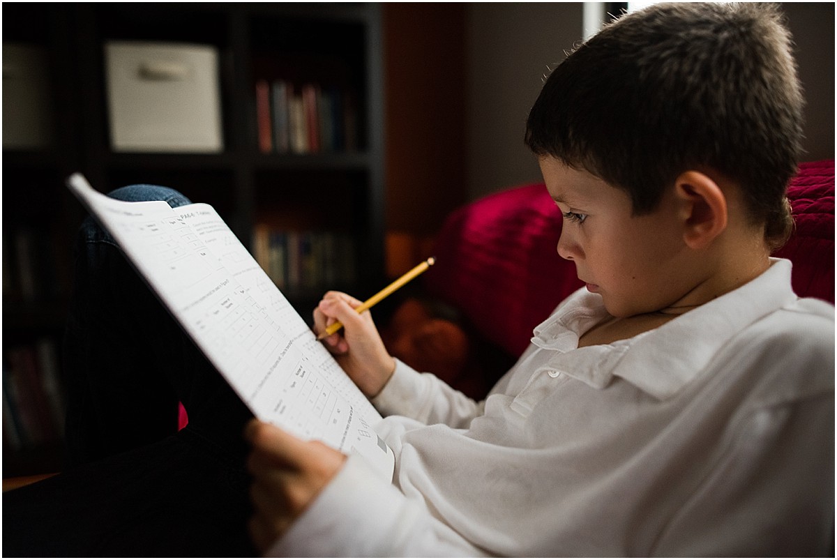 little boy doing math during his documentary photoshoot in his Costa Rica home