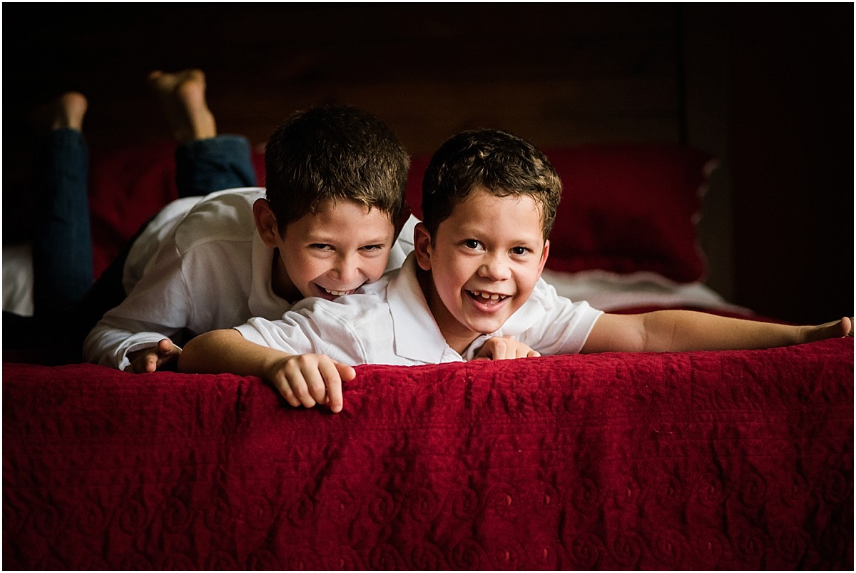 brothers giggling on bed in Costa Rica