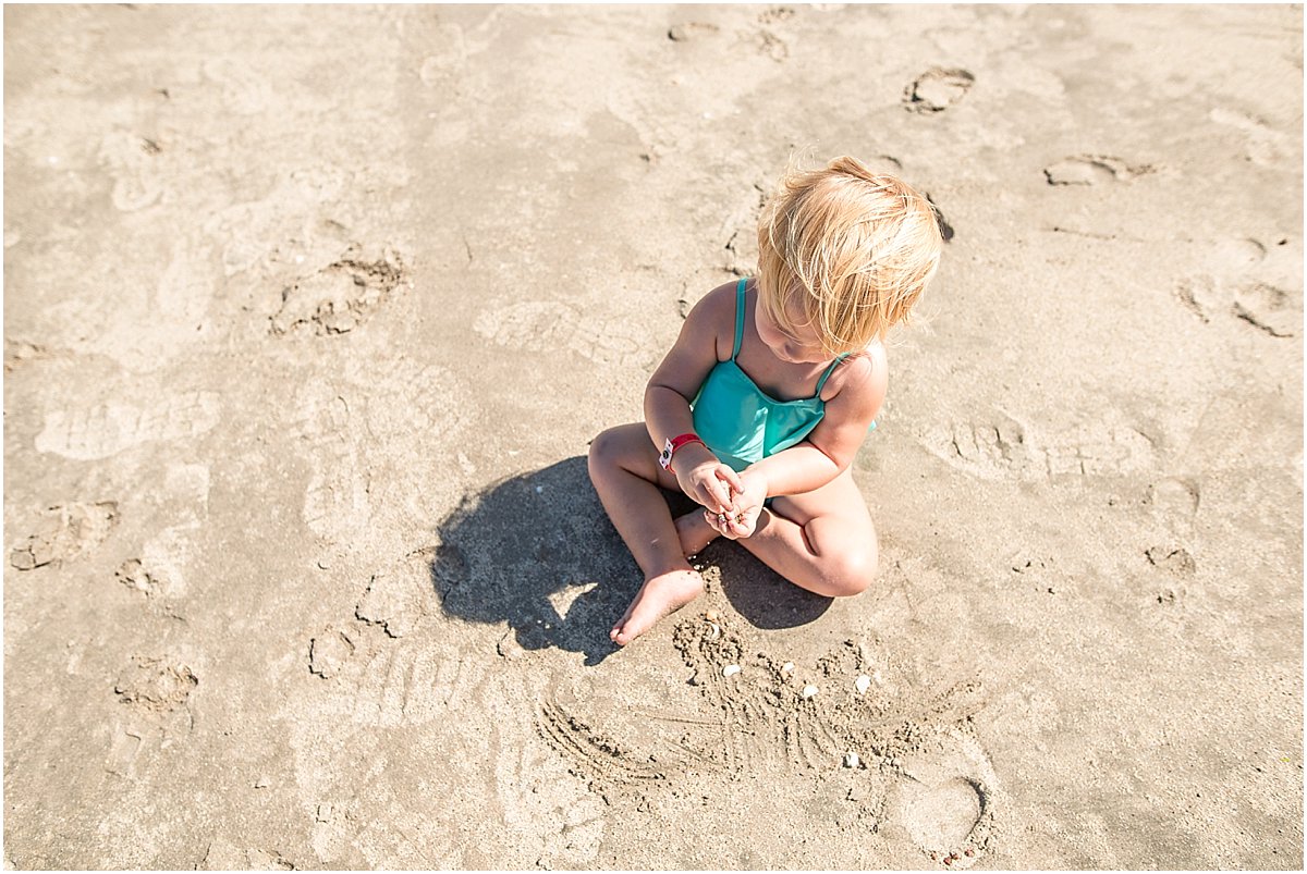 baby playing in the sand in guanacaste