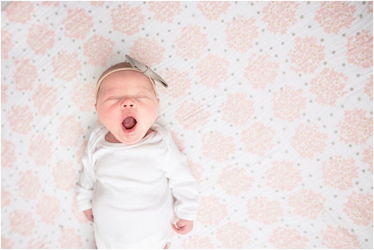 sweet baby girl yawning | non-posed newborn photography in Orlando