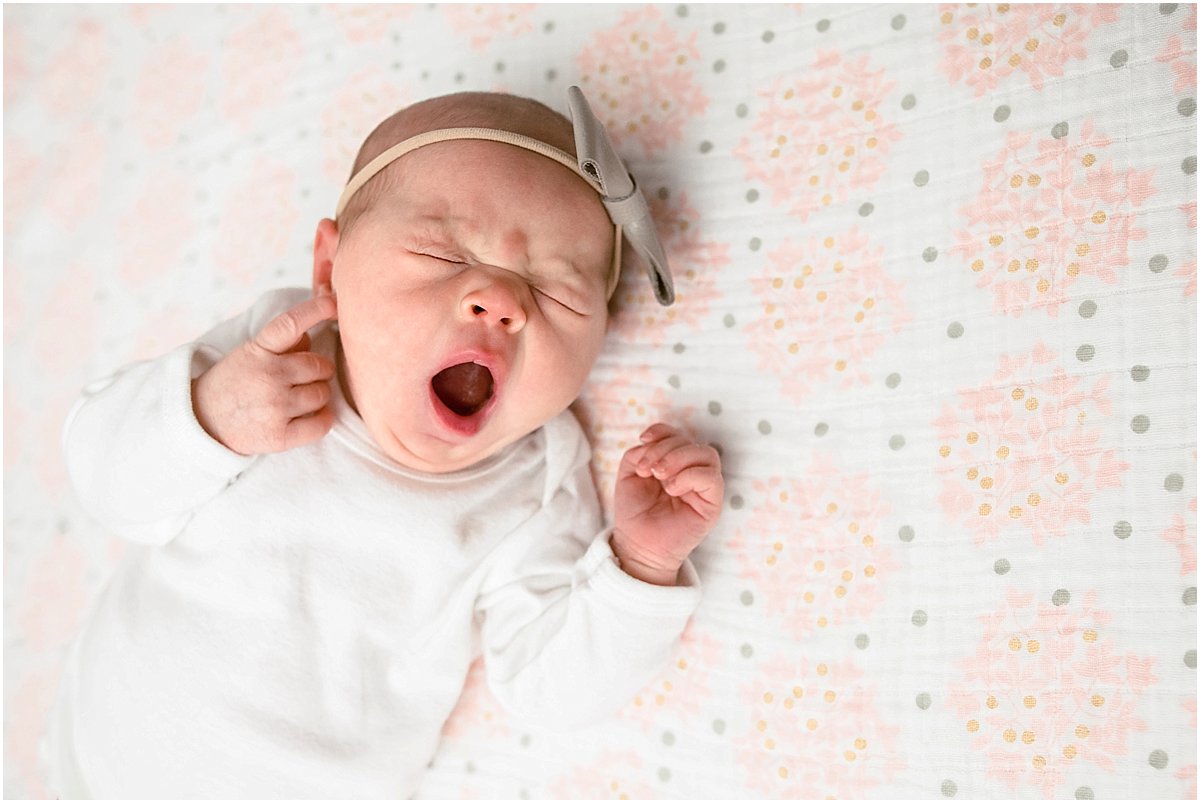 yawning baby girl | in-home newborn photography in Orlando