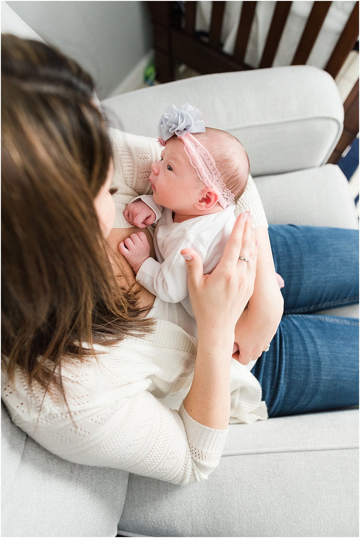 Newborn baby looking at her mom | Central Florida In-Home Photographer