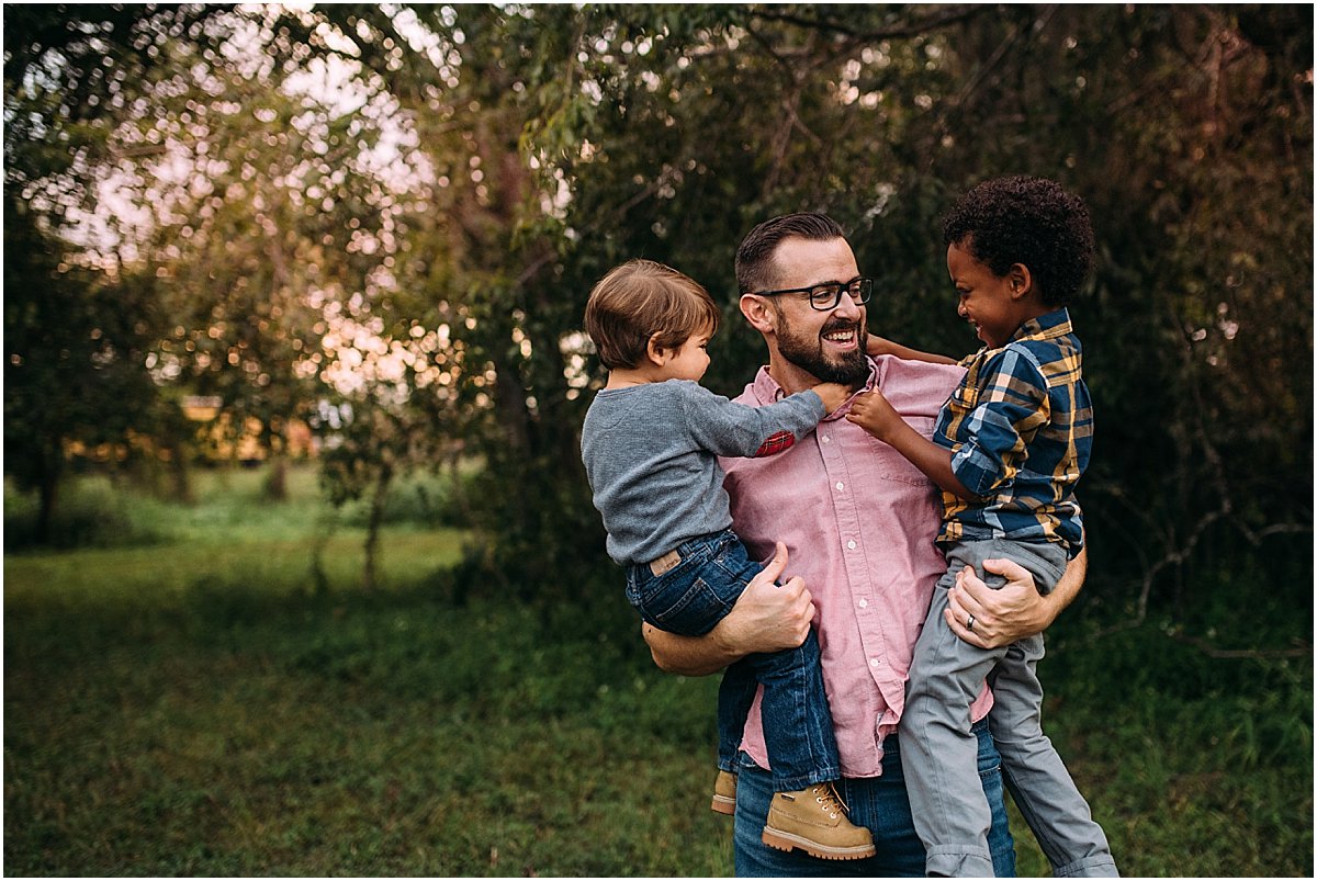 Two little boys hugging their dad | Oviedo Family Photographer