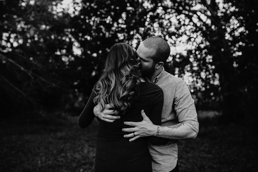 mom and dad embracing each other | Orlando couples photographer