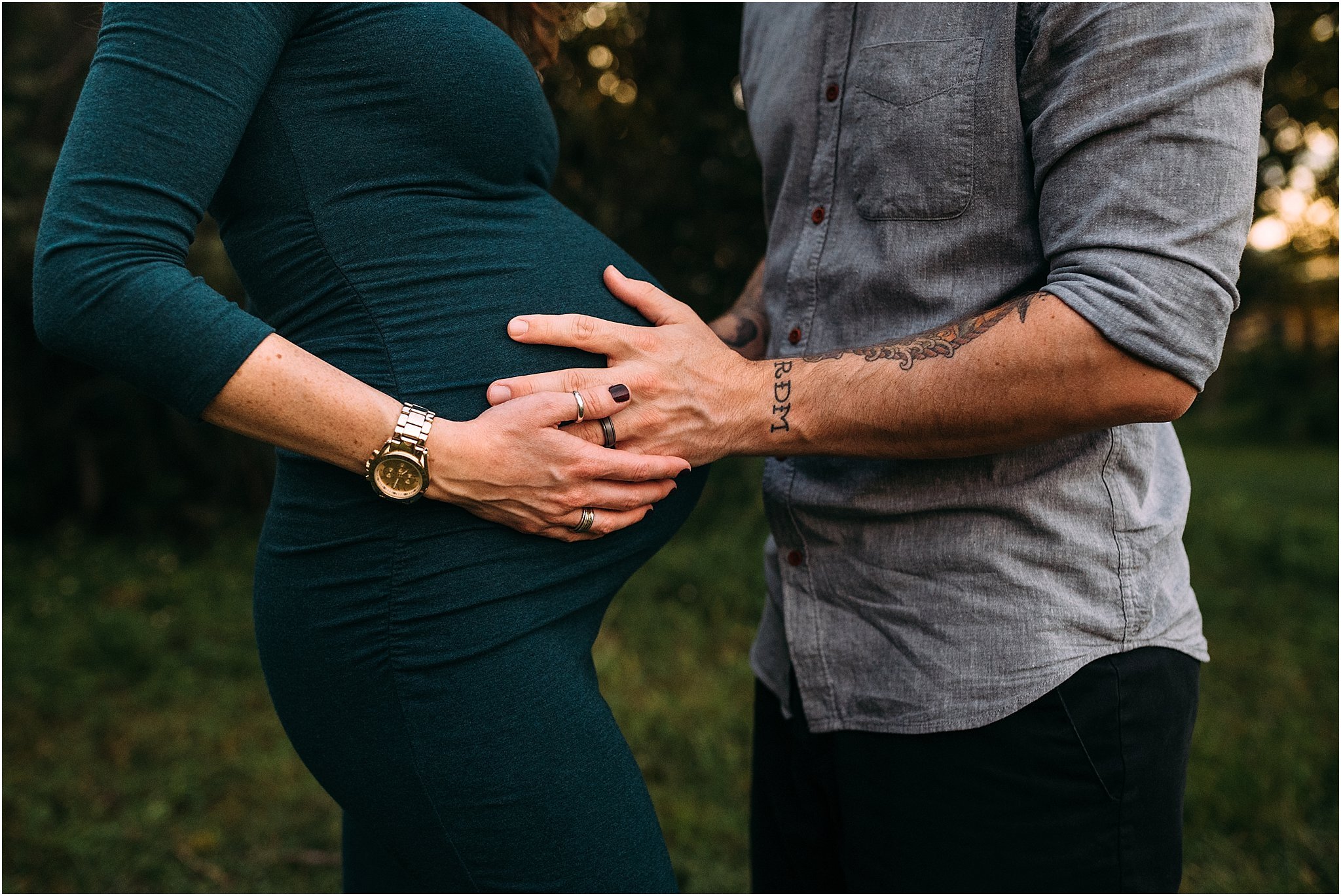 Expecting mom and dad touching mom's pregnant belly during outdoor maternity photoshoot in Oviedo, Florida. 