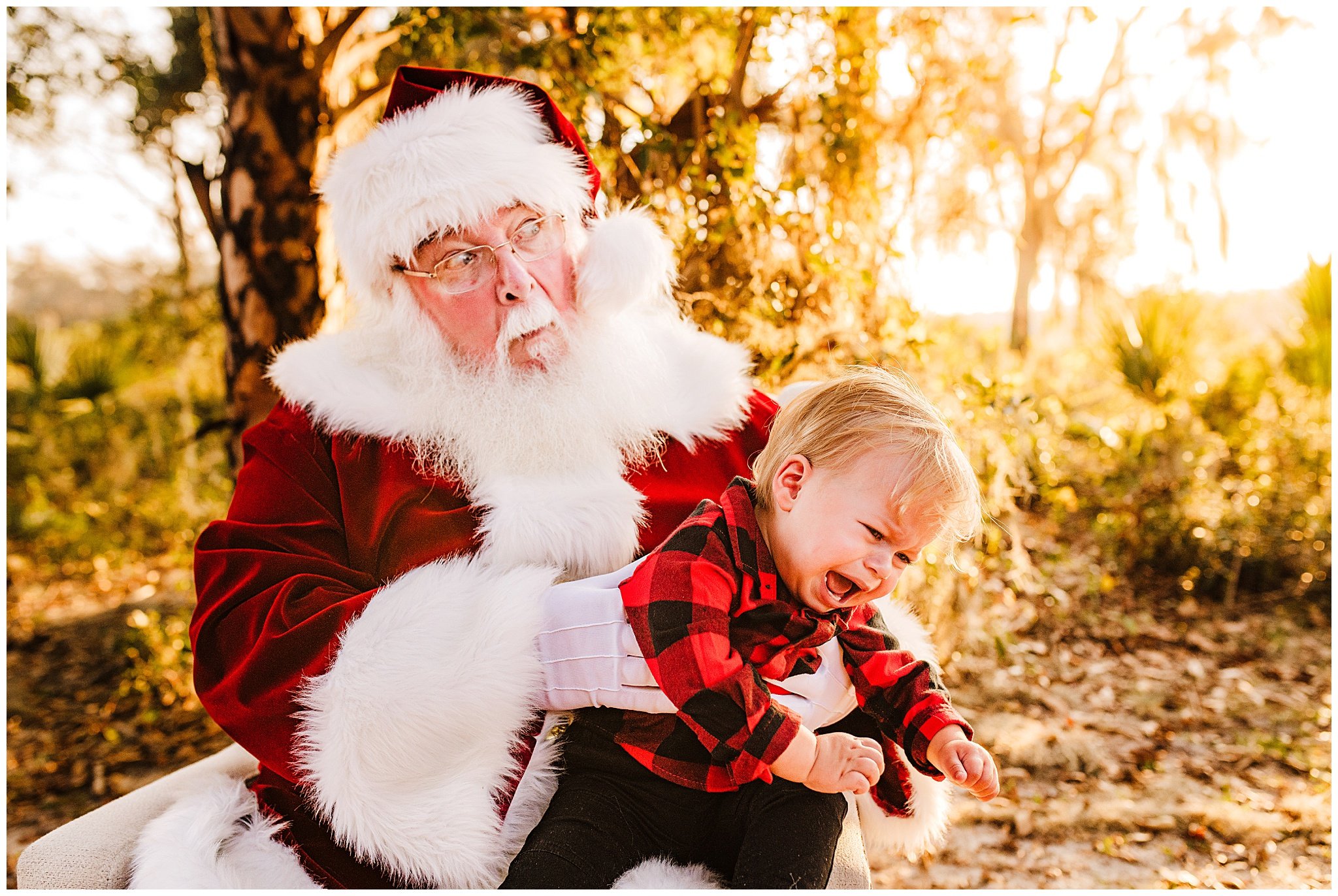 Picture of baby boy crying on Santa's lap