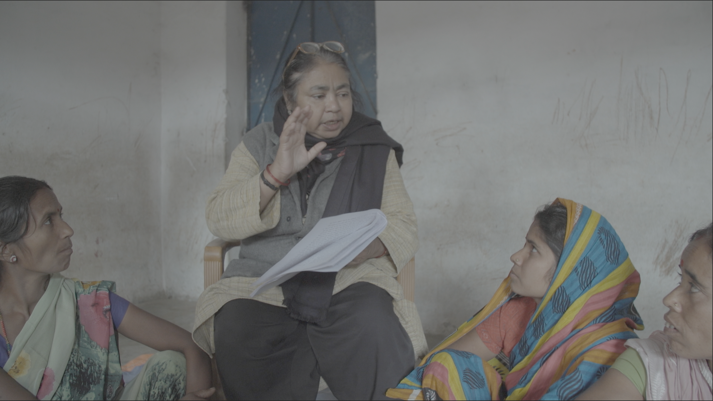 Devika Biswas reading the Supreme Court order to sterilization victims