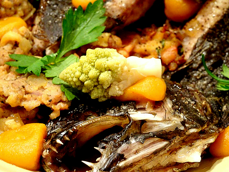 Close up of a Andouille Sausage Stuffed Flounder, Butternut Squash Puree, Pickled Romanesco