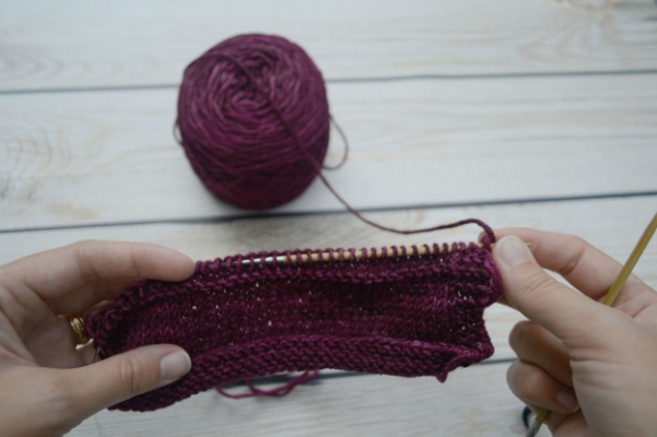 Make sure the yarn you are knitting leads back to the ball.