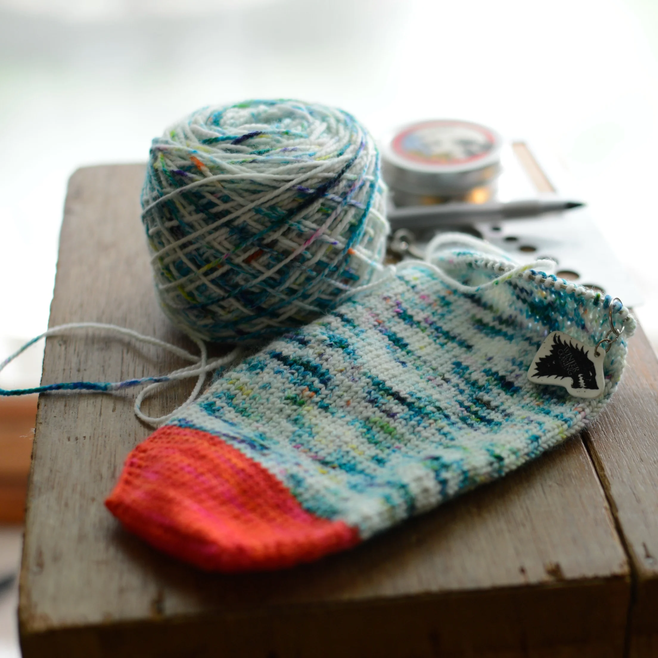 Vanilla sock with contrast toe (and future heel) in Vice trollop, main color plymouth yarn happy feet 100 splash in 101 crayon. Lo-lo to-go bar in ella mint.