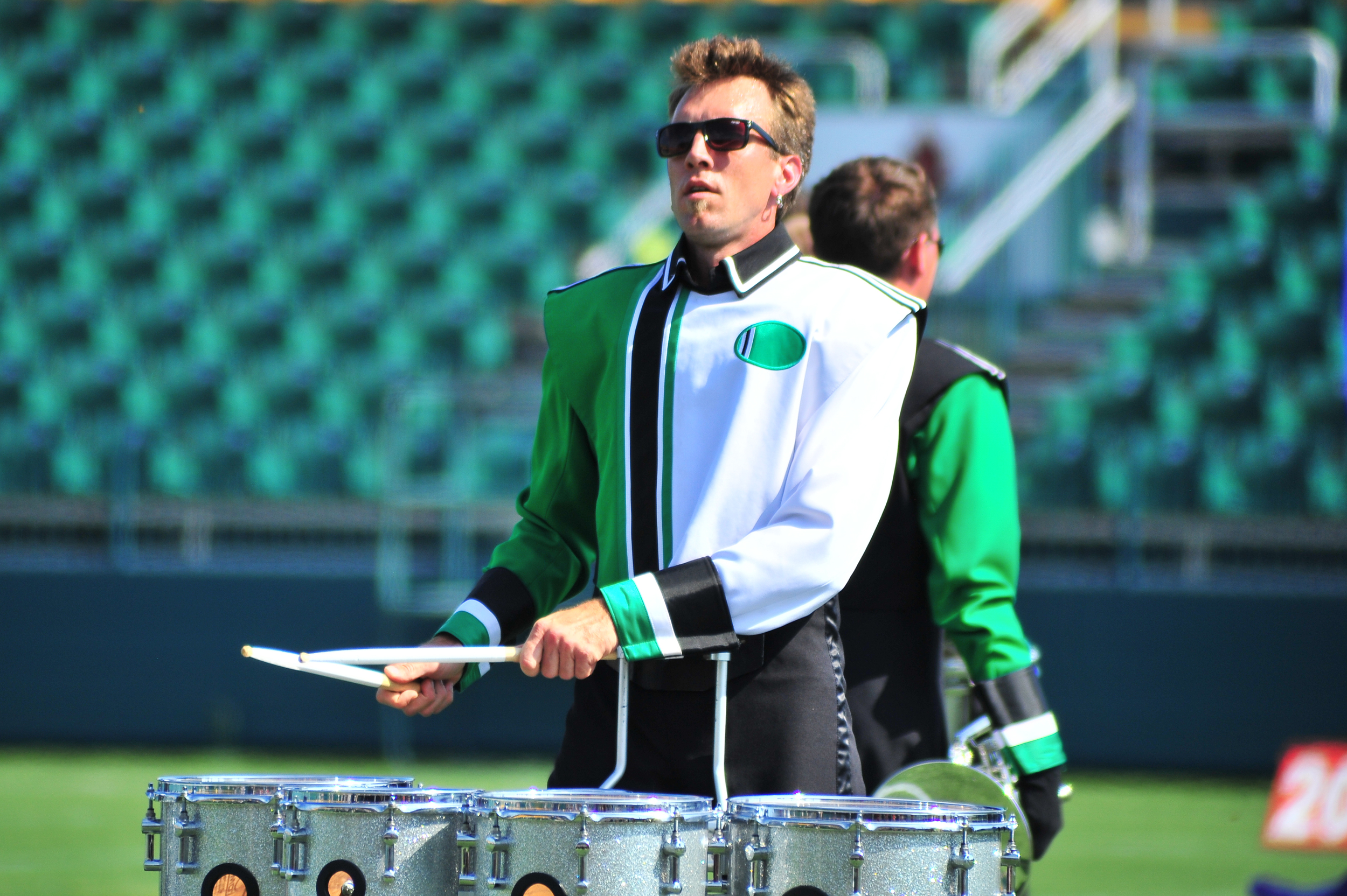 Member Justin of the Govenaires drumline performing during a drum feature section of the show at the Drum Corps Associates 2014 Championships Photo provided by corpsreps.com Full Resolution
