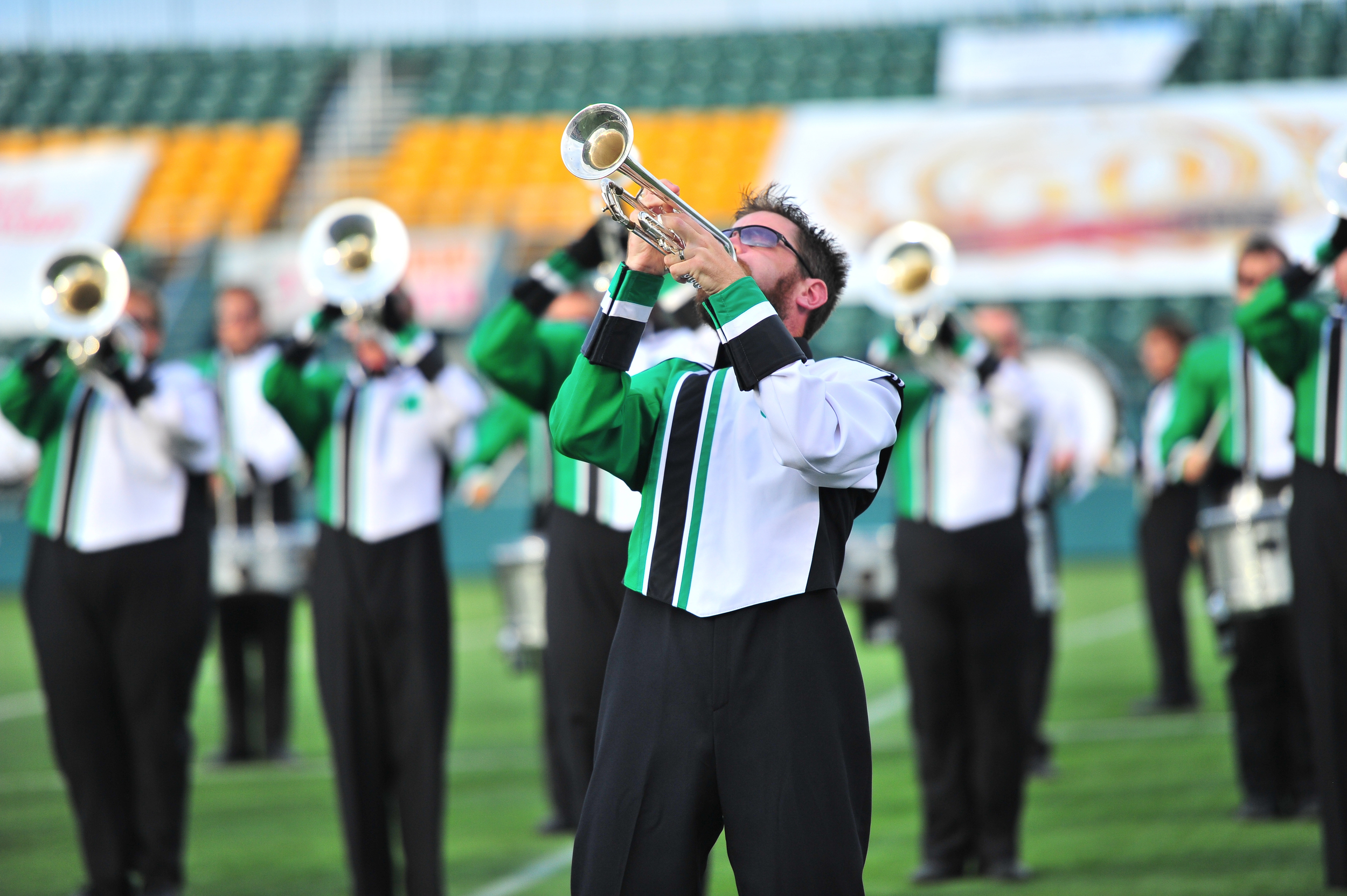 Govenaires Hornline member Aaron plays a high note during the opening impact of the show at the Drum Corps Associates 2014 Championships Photo provided by corpsreps.com Full Resolution
