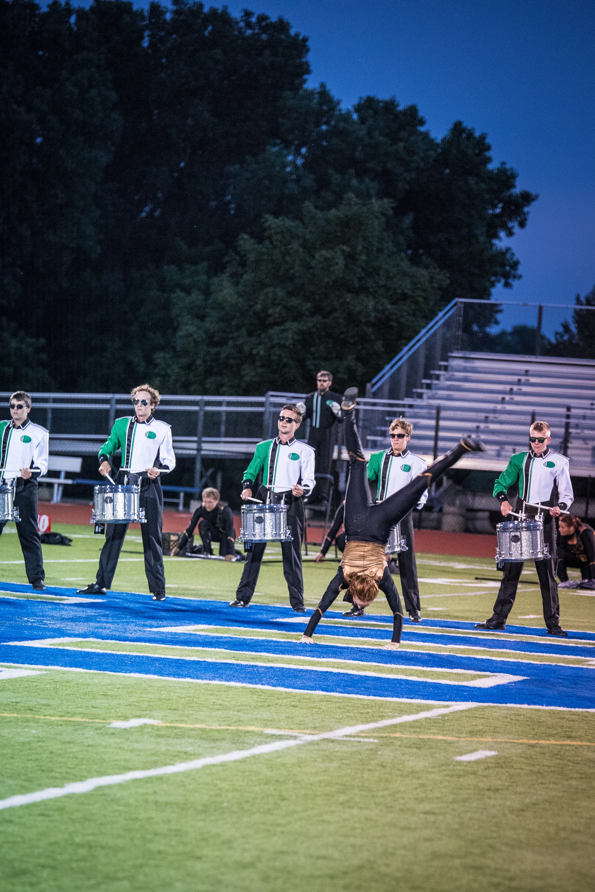Colorguard member Alex and members of the snareline perform a snare feature at the beginning of the closing segment of the 2015 production "Outlaw" at the Sounds of Minnesota show hosted at St. Thomas Academy in August. Photo provided by TwinCitiesMedia.net Full Resolution