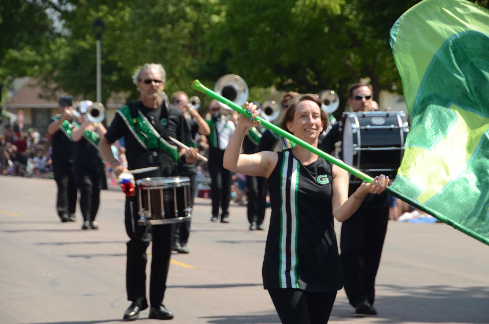  The Govenaires Parade and Concert Corps brings music and pageantry to celebrations in small towns across Minnesota. Ruth Stark, a longtime Govenaire, is seen here mid-routine during a parade in LeSueur, MN. 