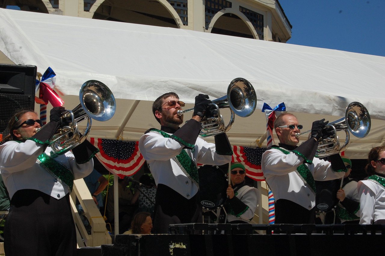   Govenaires Jenniffer Whitworth, Aaron Hartwell, and James Henry perform in a concert as part of 4th of July Festivities in Minnesota Square Park in St. Peter, MN in 2011. The corps performs in St. Peter 6-times a year, on average.  