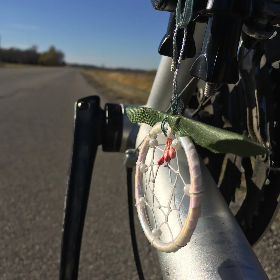 In over 2000 km of highway travel a total of about 4 cars stopped to say hello. I was gifted this wonderful little dream catcher by a kindred spirit as I biked towards Portage la Prairie.