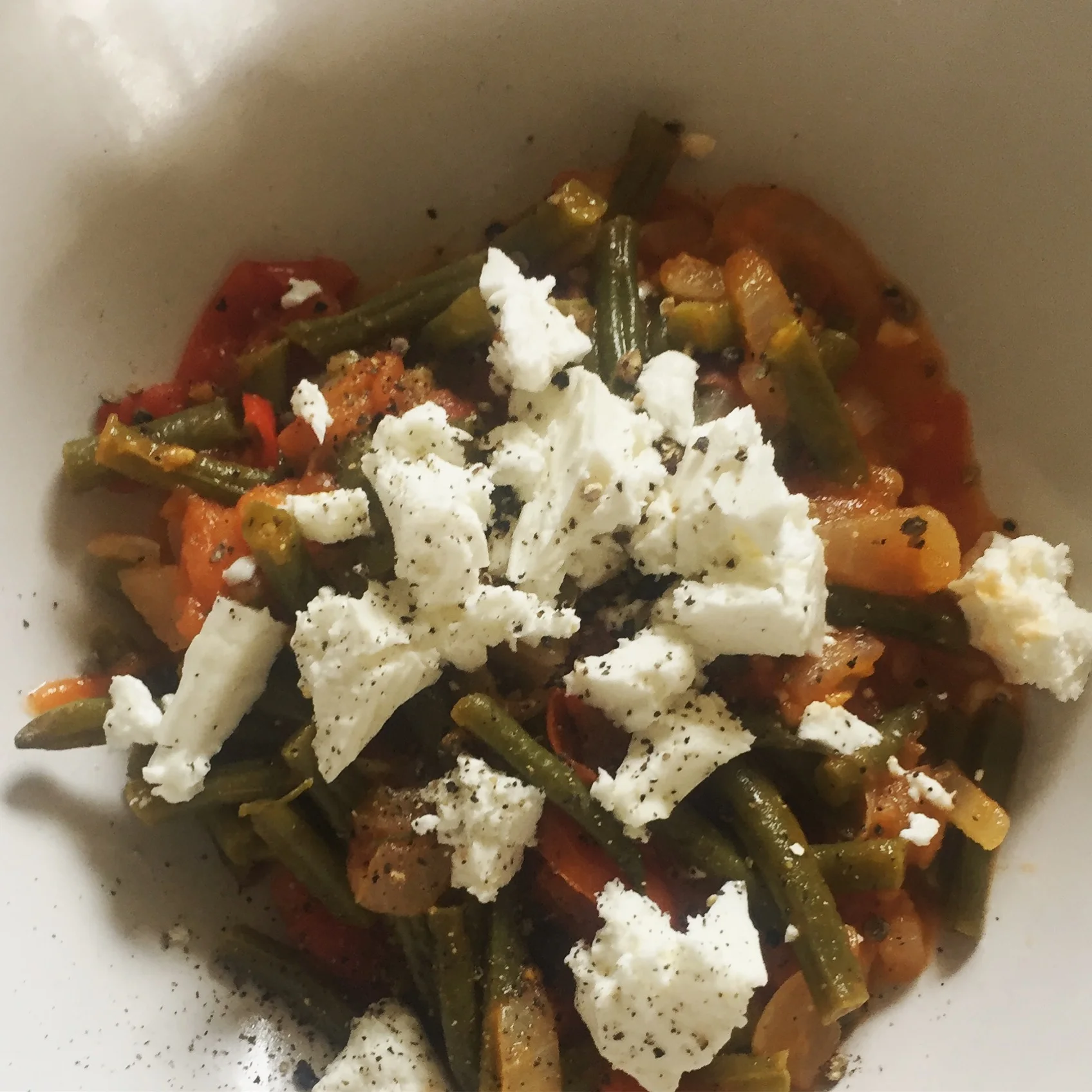 Green beans, onions, tomatoes + feta
