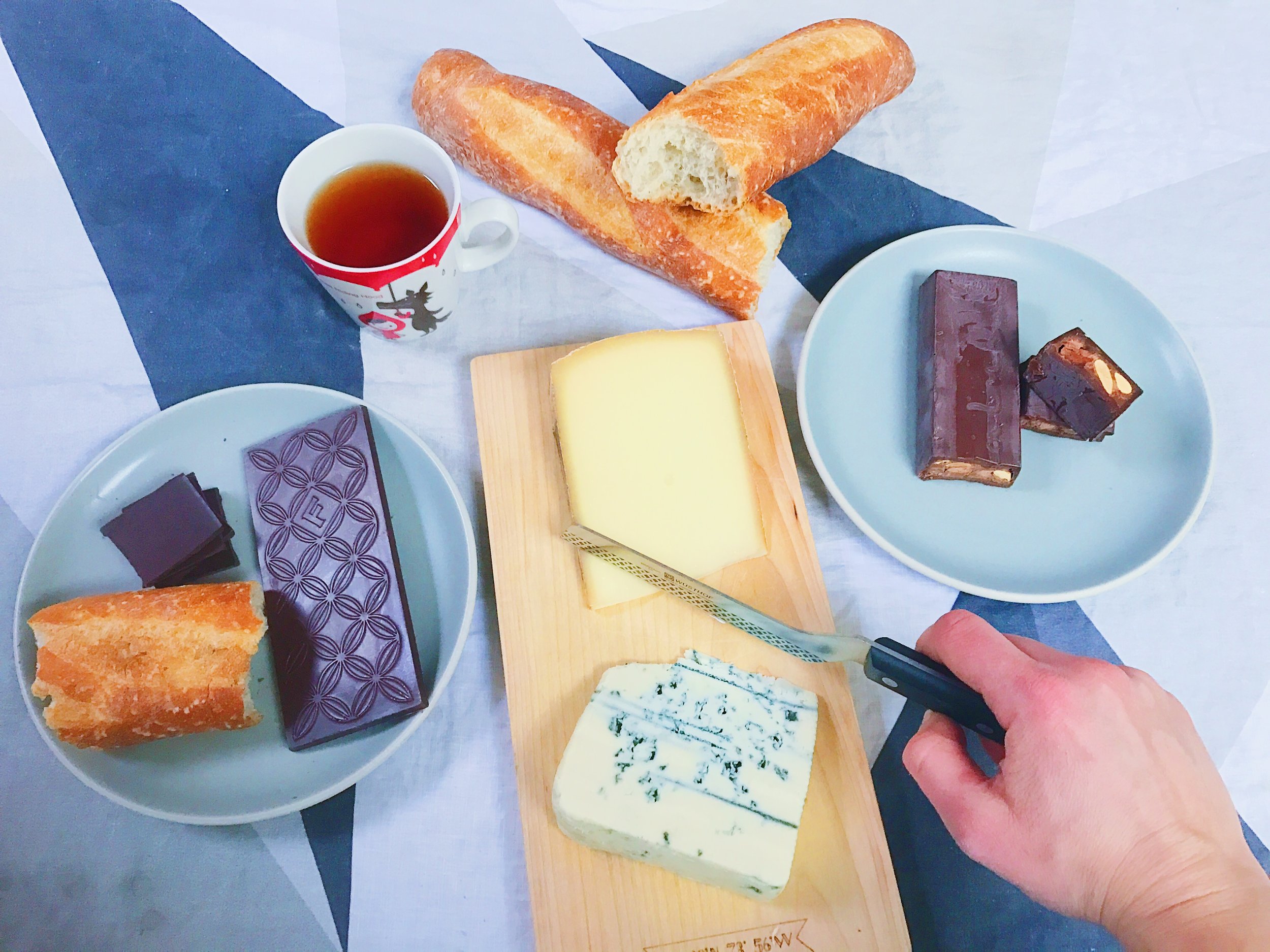 Feast time! It’s all about the combinations, which I discovered while doing extensive research for my book (poor me, right?). I’m pairing Fruition Chocolate 's dark milk chocolate with sea salt with Challerhocker cheese and that Pralus Infernale bar I mentioned earlier with Point Reyes Cheese's Original Blue. Both chocolates also pair well with this Nepalese oolong tea from Serendipitea. I threw in a baguette to pair with some single-origin Madagascar chocolate from Patric too, because why not? The fruitiness of the Madagascar chocolate with the buttery nuttiness of the baguette makes it taste like a fantastic peanut butter and jelly sandwich.