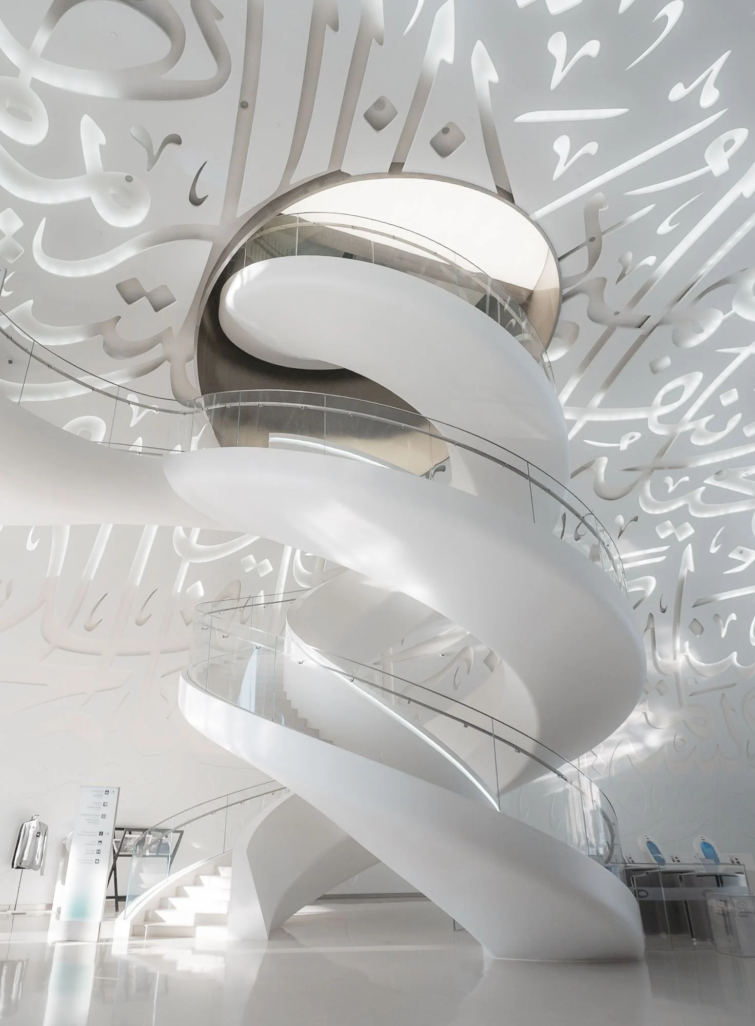 Cityscape 
 White Symphony 
The interior of Dubai's Museum of the Future with Arabic calligraphy embedded in the ceiling.