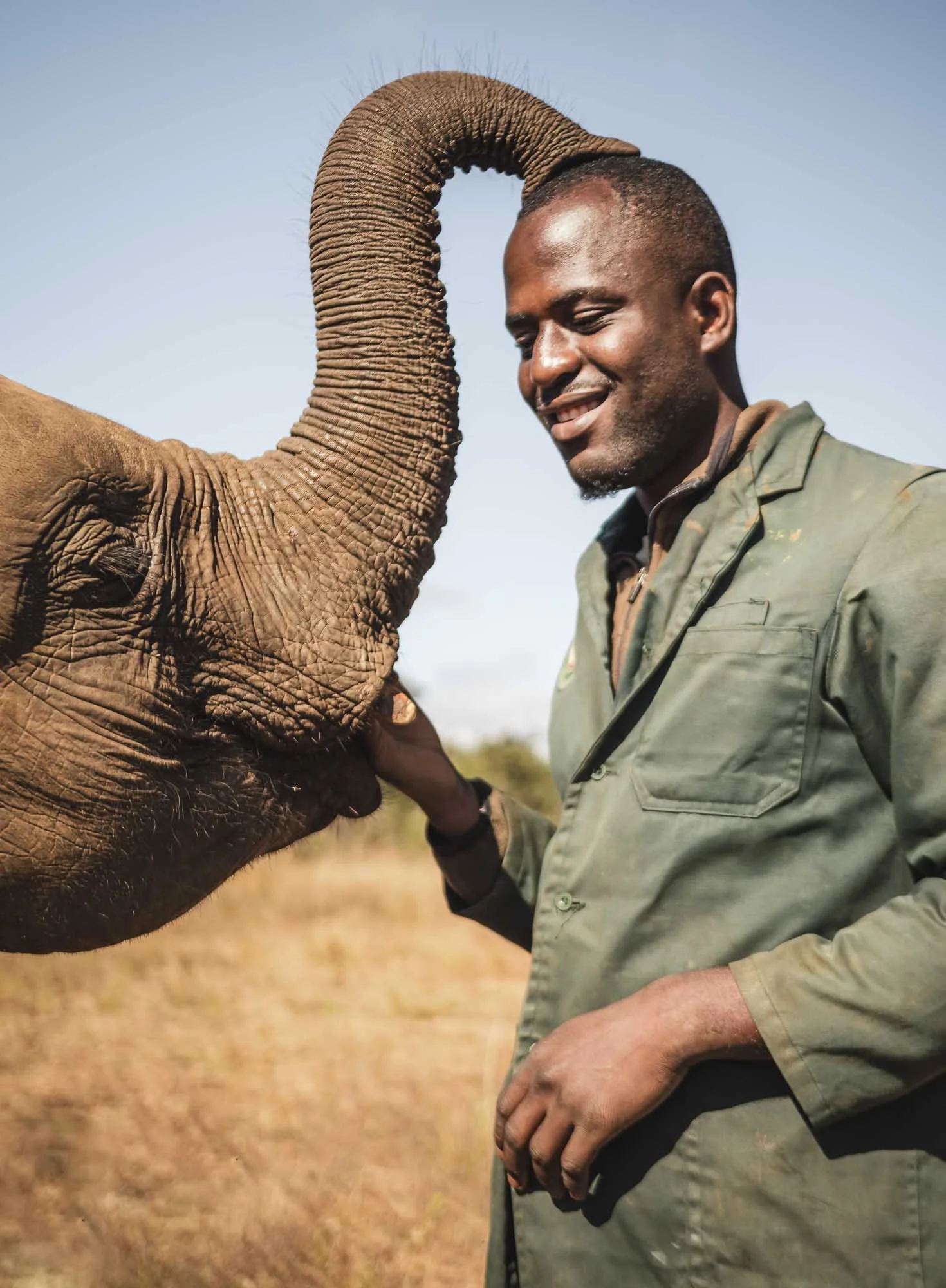  Everything Else 
 Touch of a Trunk 
Matthews, one of the keepers at the Lusaka Elephant Orphenage interacts with one of his proteges.