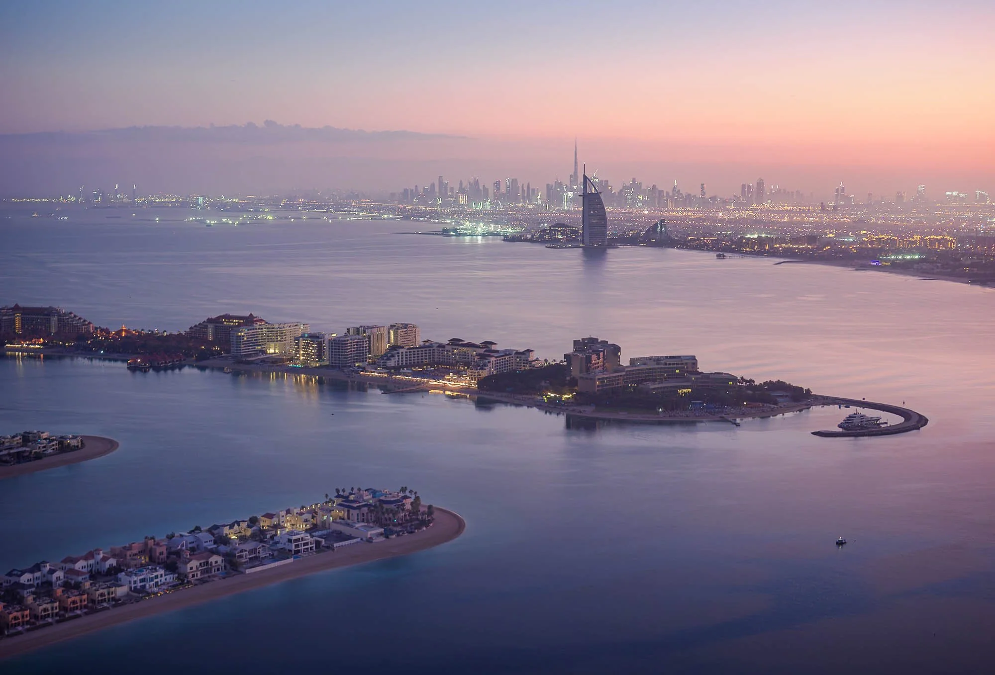  Cityscape 
 Dubai Morning Hues 
Looking eastwards on a calm clear winter morning in Dubai, with many of the city's iconic landmarks in view.